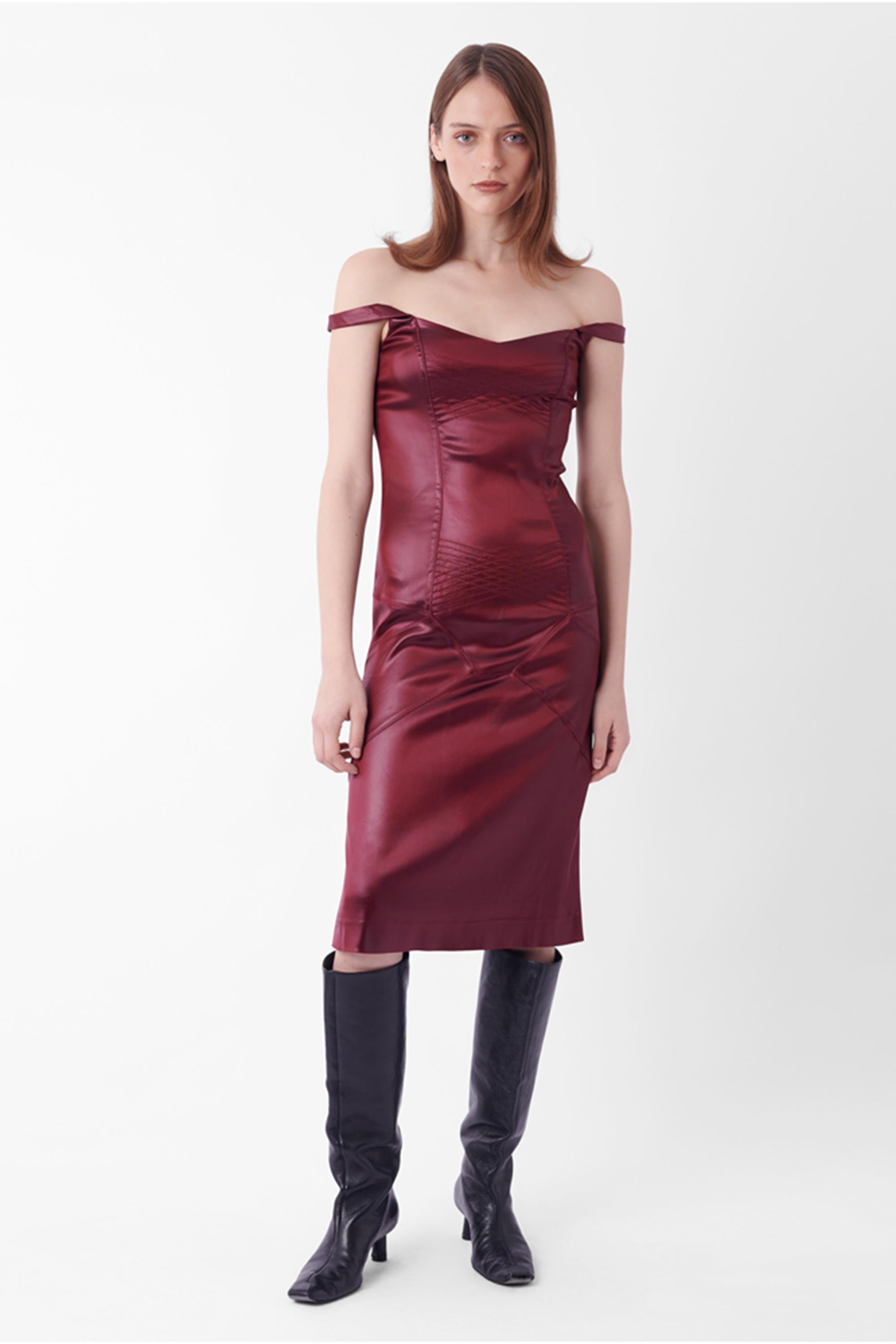 John Galliano Fall Winter 2000 burgundy dress, closing runway look. This runway satin dress features, optional off-shoulder silhouette, stitched detailing and side zip fastening closure. In excellent condition.

Brand: John Galliano
Size: UK