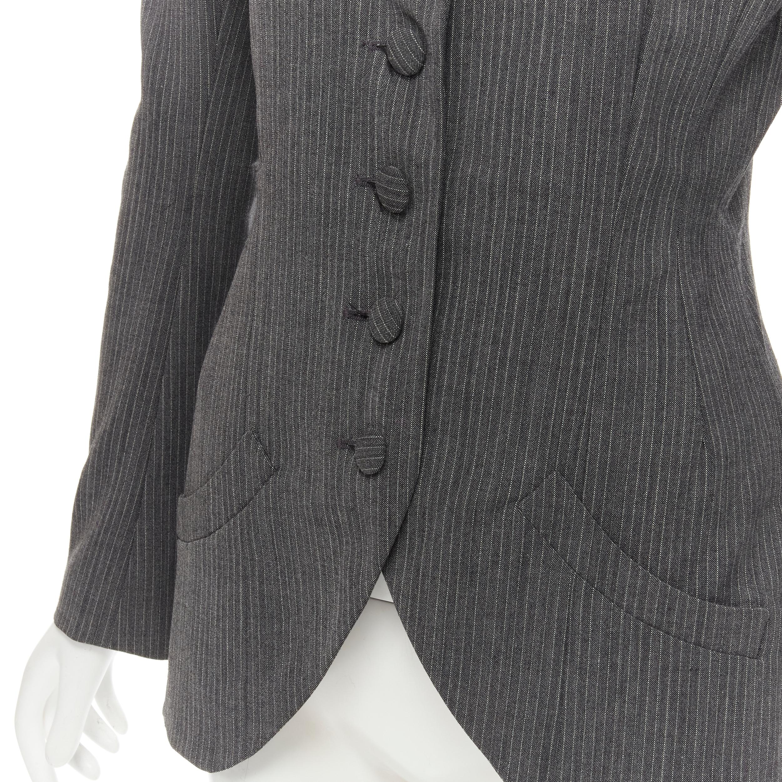 JOHN GALLIANO Vintage grey pinstriped wool blend fitted waist blazer FR38 M 
Reference: AEMA/A00084 
Brand: John Galliano 
Designer: John Galliano 
Material: Wool 
Color: Grey 
Pattern: Pinstriped 
Closure: Button 
Extra Detail: Padded shoulders.