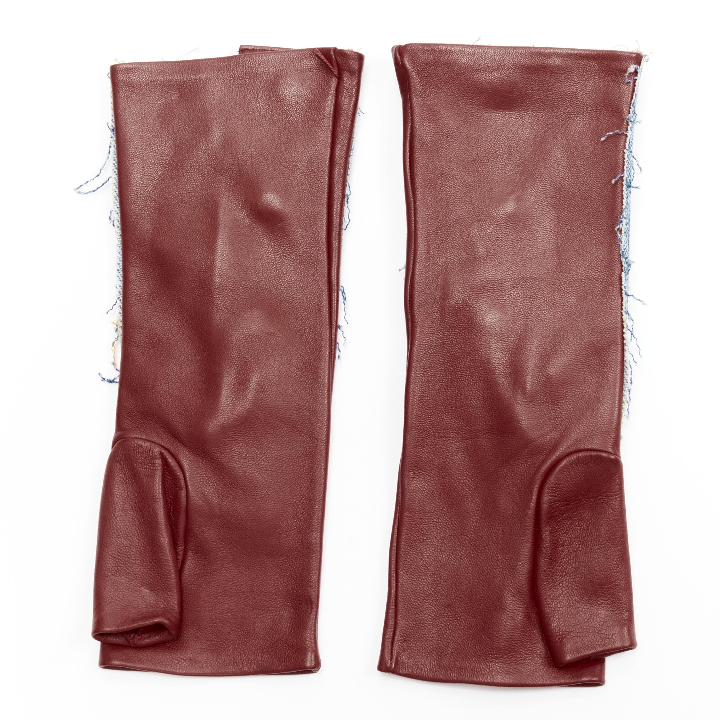 JOHN GALLIANO Vintage red calfskin leather denim fingerless floves
Brand: John Galliano
Designer: John Galliano
Material: Calfskin Leather
Color: Burgundy
Pattern: Solid
Closure: Button
Extra Detail: Antique gold tone curve J buttons.
Made in: