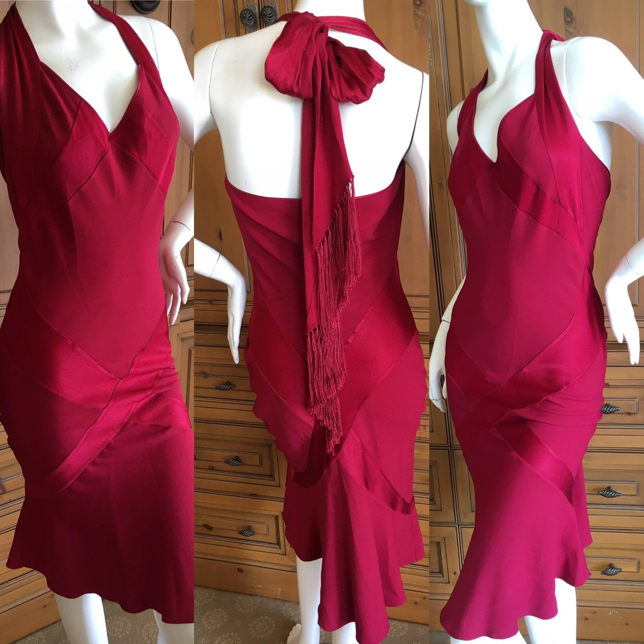 John Galliano Vintage Red Dress With Tassel Tie Back
Designed, as Galliano often did, using the front and the back of the fabric 
to show contrasting patterns in the dress.
 Size 40
 Bust 36