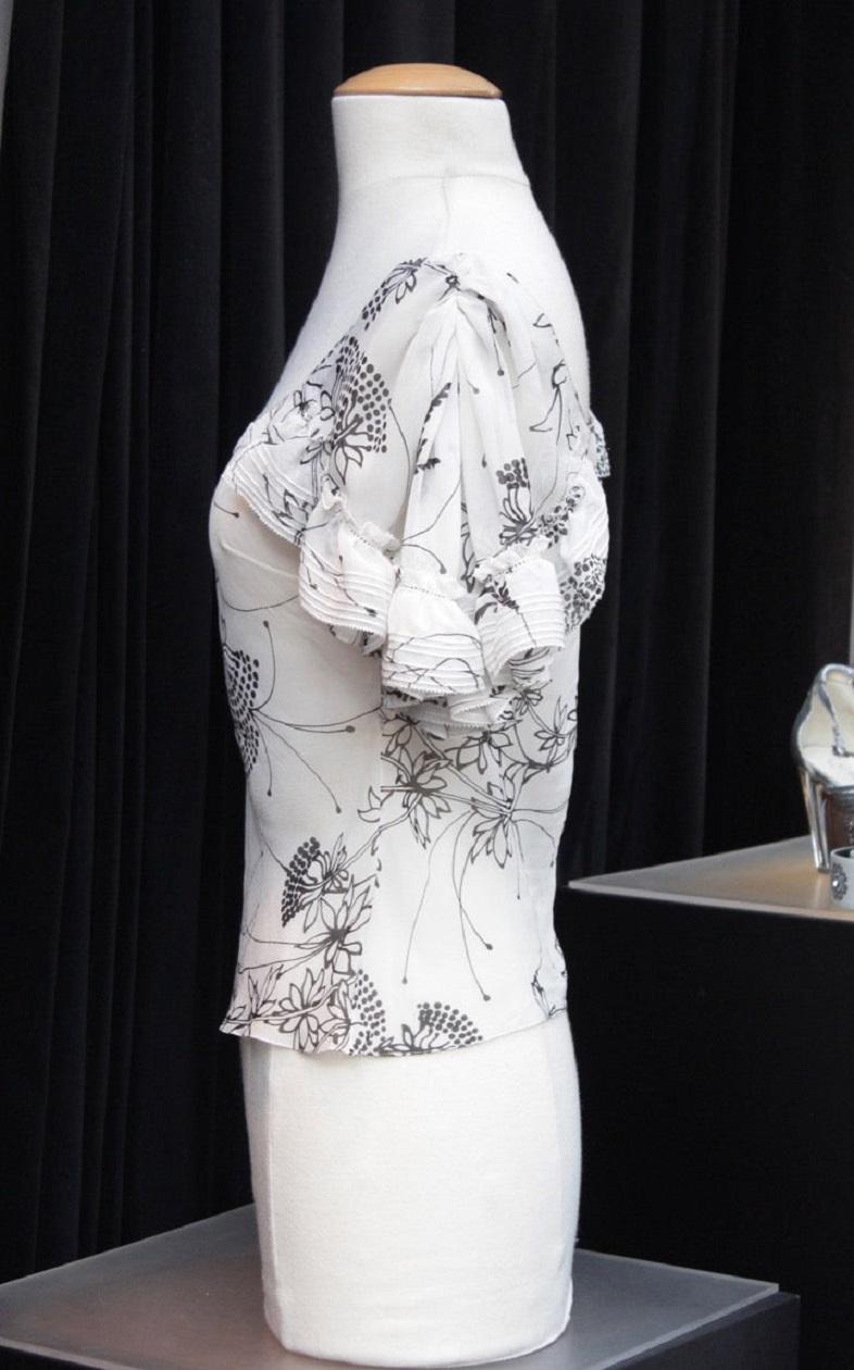 John Galliano - Transparent top in white and black silk. Collection of the early 2000s.Composition and size labels missing, it fits a 36FR.

Additional information:
Dimensions: Shoulder width: about 44 cm (17.3 in)
Bust: 48 cm (18.9 in) 
Waist: 42