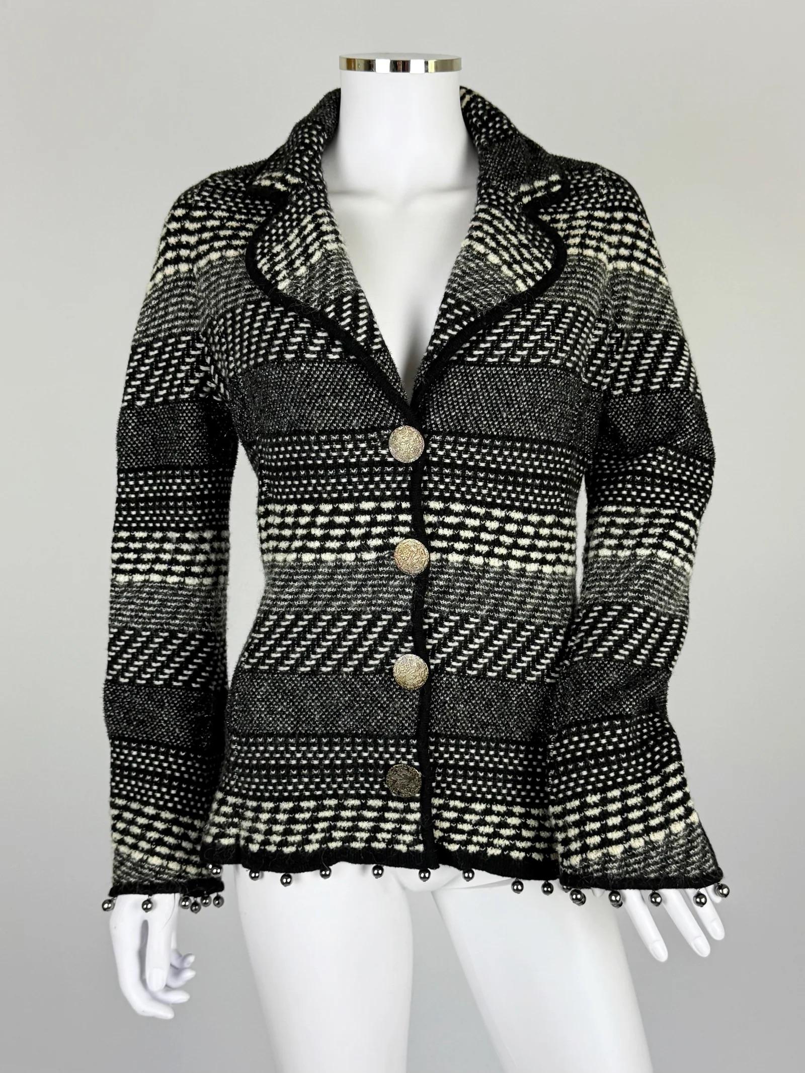 John Galliano monochromatic wool jacket, Fall Winter 2004
Brass beading at hem and at cuffs
Very good vintage condition, missing brand label but composition label is attached 
Does up with metal buttons engraved in a botanical pattern
75% wool 10%
