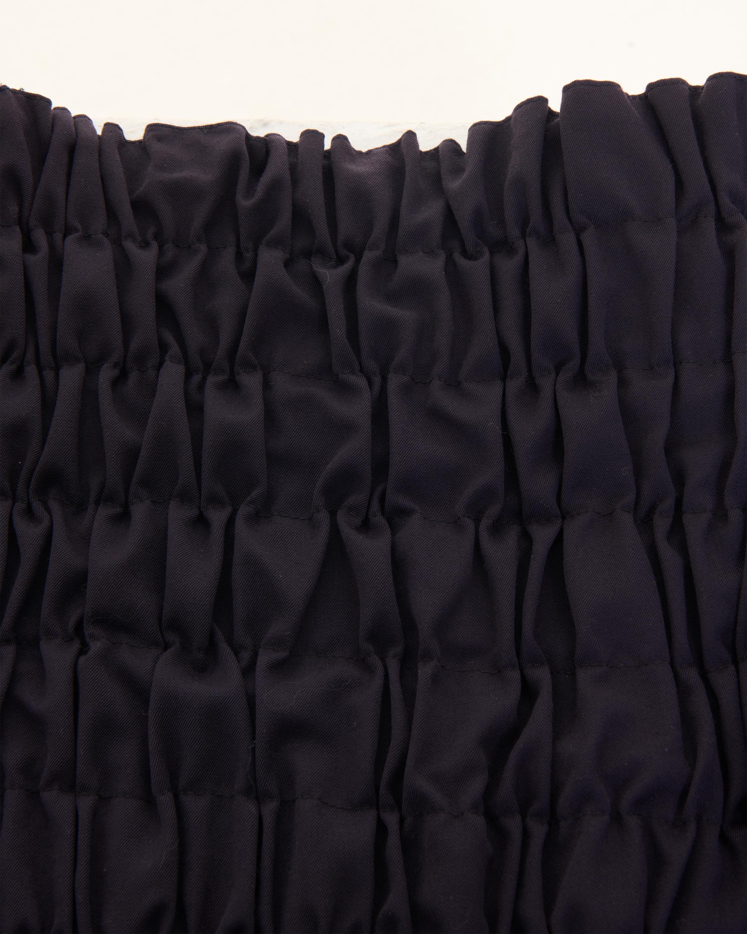 John Galliano	F/W 1986 ‘Fallen Angels’ collection plum wool overlapped skirt 1