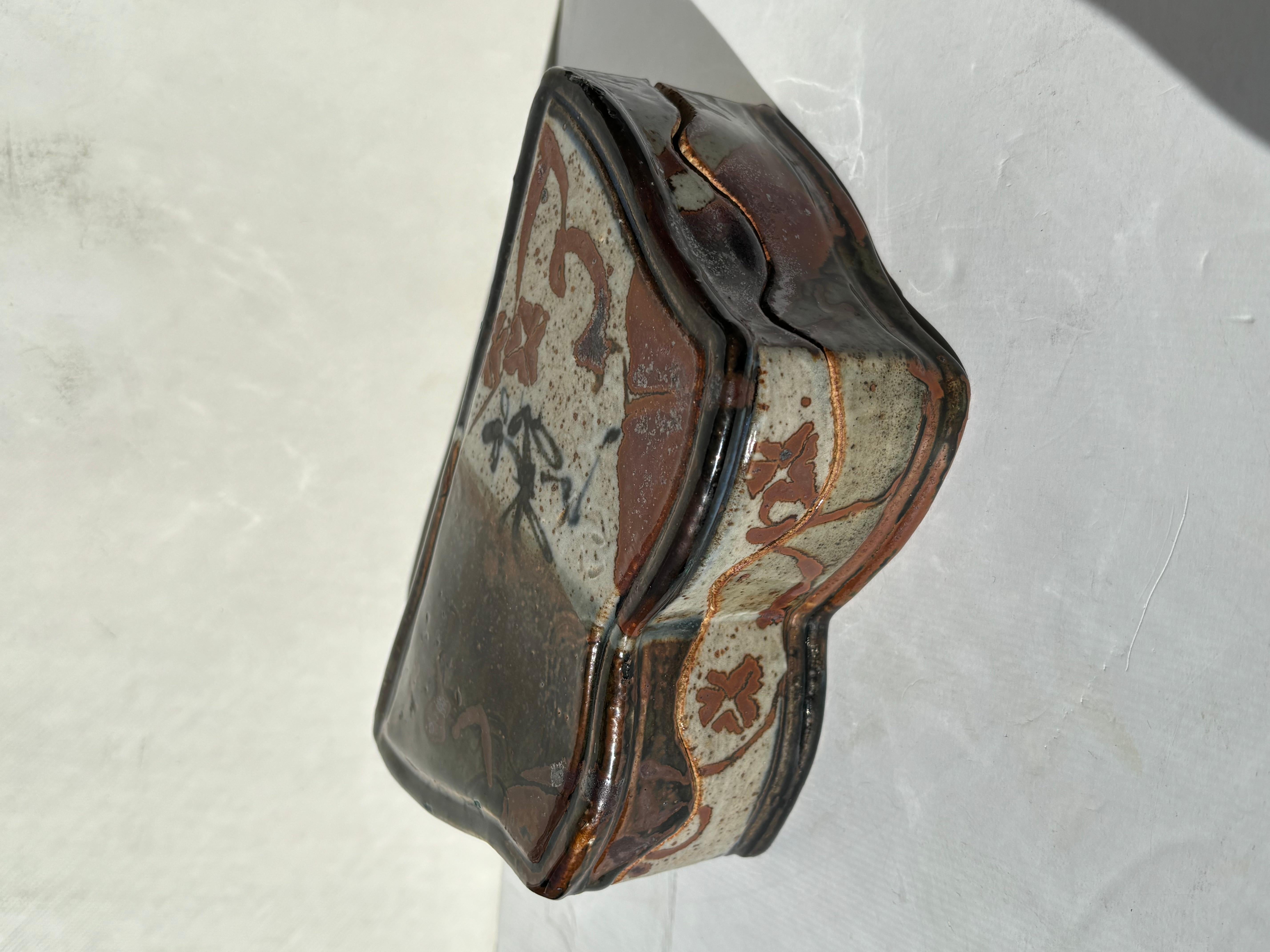 Beautiful box with waved design in stoneware / ceramic. Made by Plum Tree Potters, John Glick.
