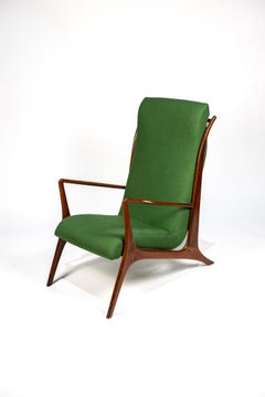 John Graz. John Graz armchair, c. 1960 Caviuna wood and linen tapestry