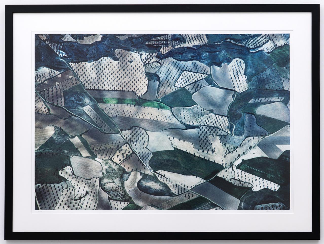Contemporary aerial landscape photograph of blue, gray, green and teal farm fields captured from the photographer's plane over La Mancha, Spain
Archival digital print, edition 5 of 25
Image size: 26 x 39 inches
Framed size: 36 x 48 x 1 inches, black