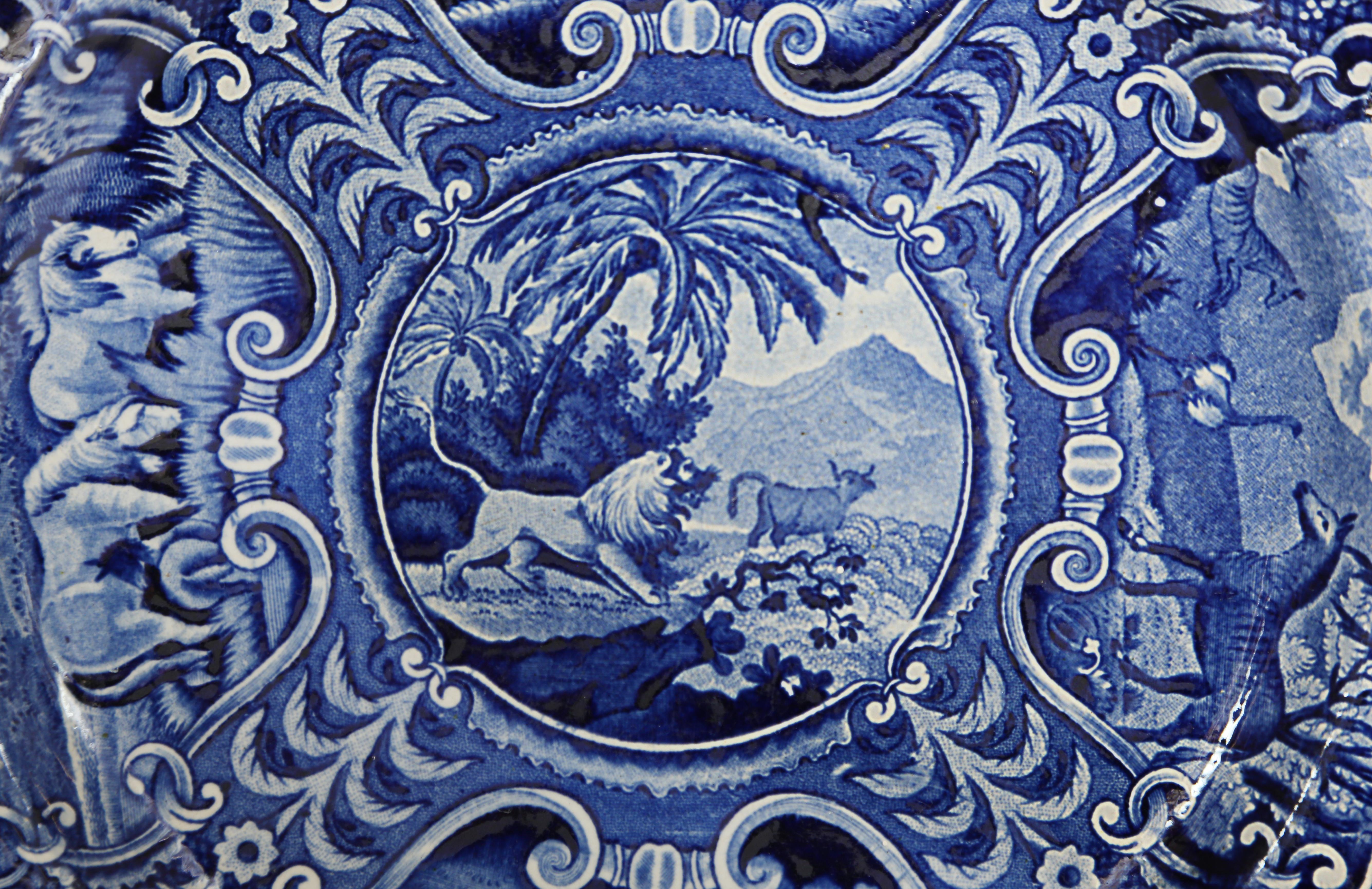 A deep cobalt blue glazed earthenware dinner plate from the 