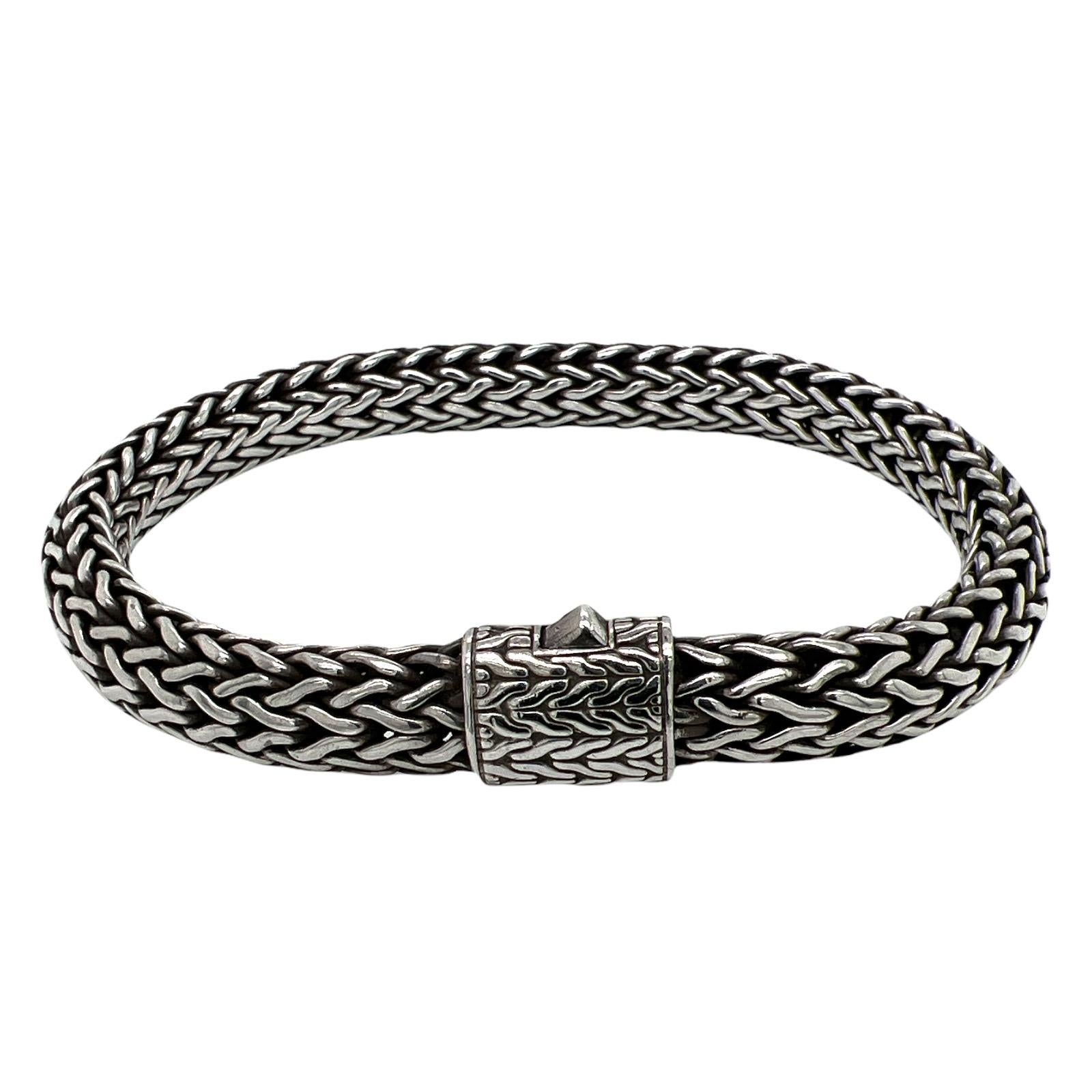 John Hardy Classic Chain bracelet fashioned in sterling silver. The bracelet measures 11mm in width, and 9 inches in length. Signed JH 925. 
MSRP: $1,075.00