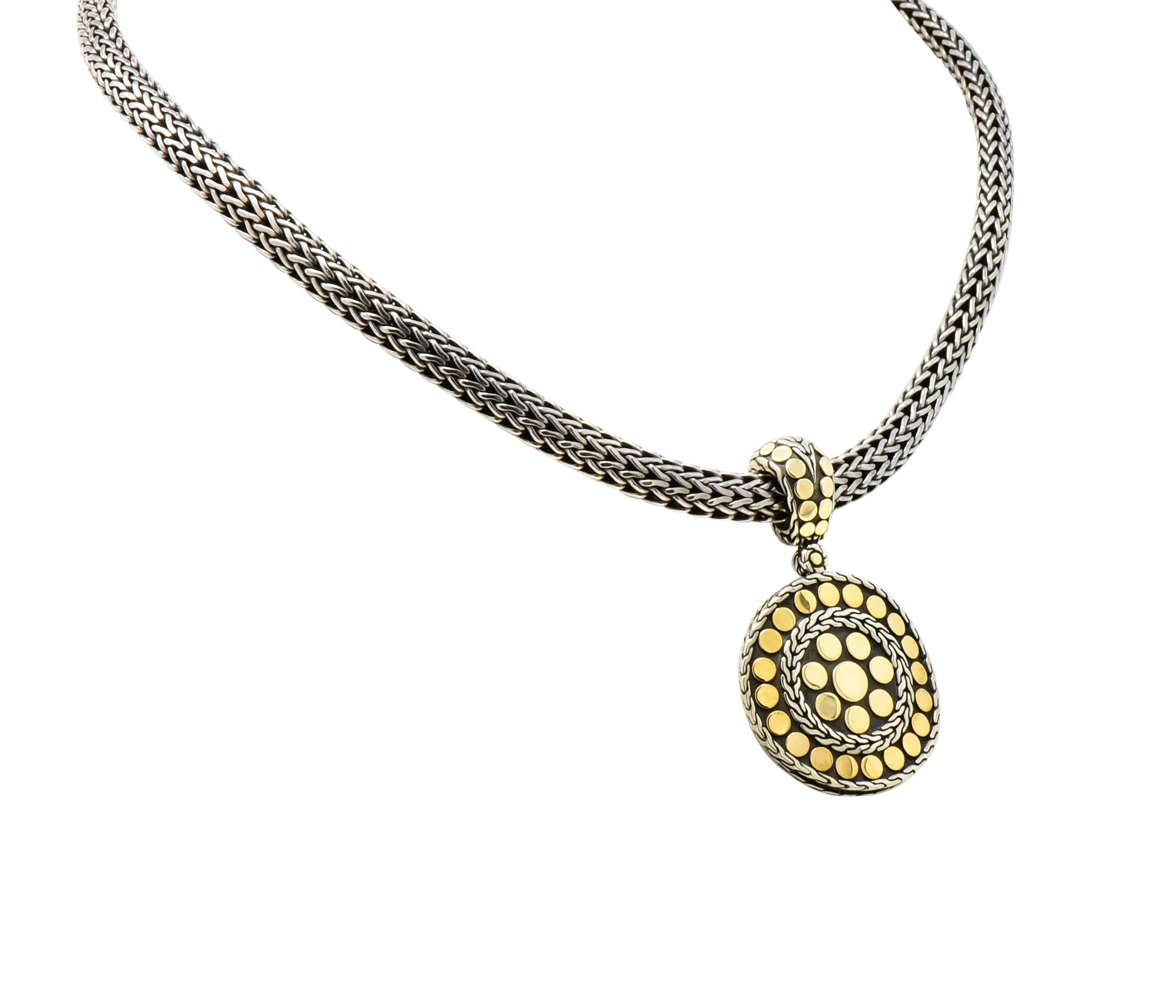 Designed as a circular, removable, enhancer pendant

Accented throughout by high polished gold dots and surrounded by wheat motif

Accompanied by a substantial sterling silver woven wheat chain completed by a decorative single presser clasp

From