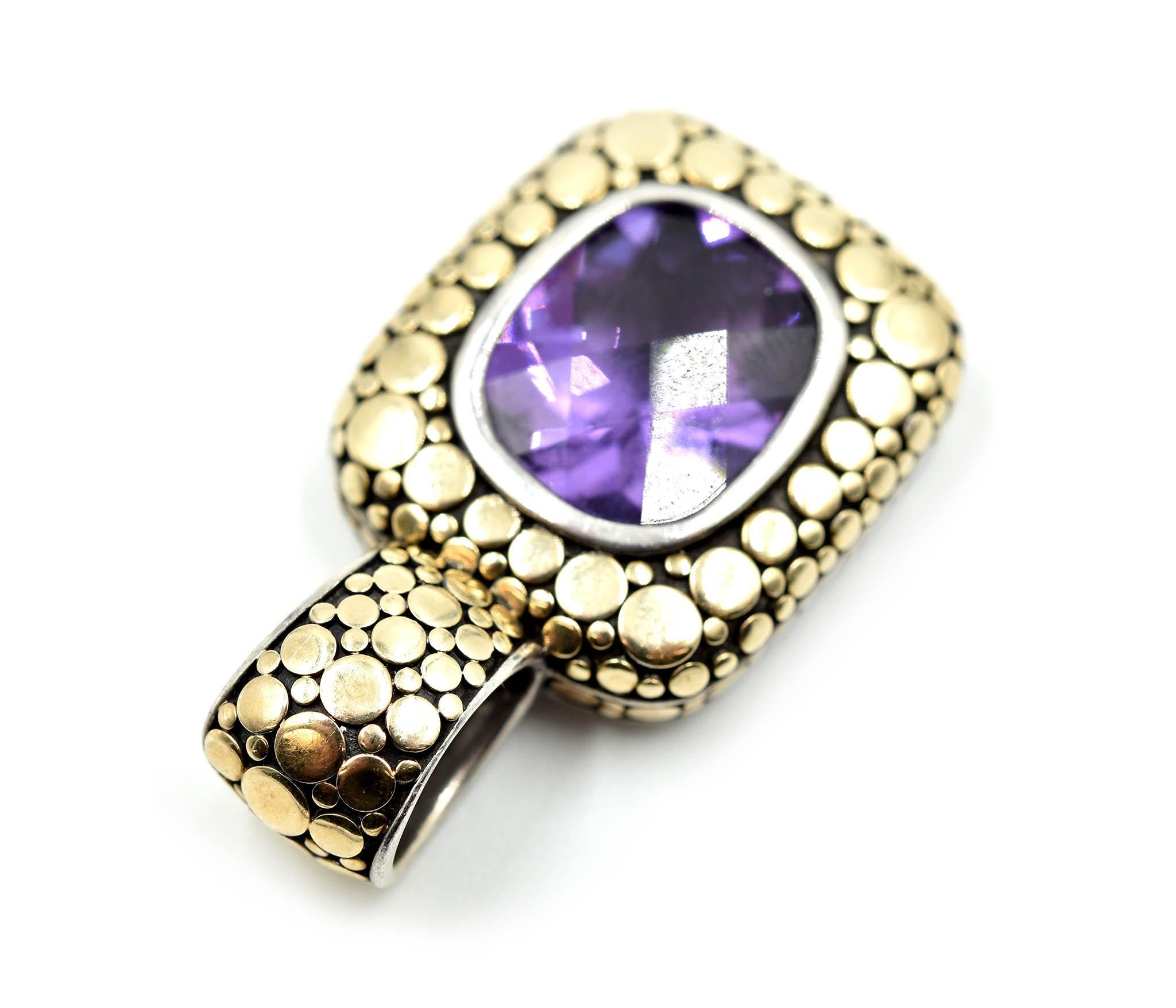 This style by John Hardy is timeless! The pendant is designed in 18k yellow gold and sterling silver. The center of the pendant is set with a checkerboard cushion cut amethyst gemstone. The dazzling gemstone measures 13.13mm in length and 11.23mm in