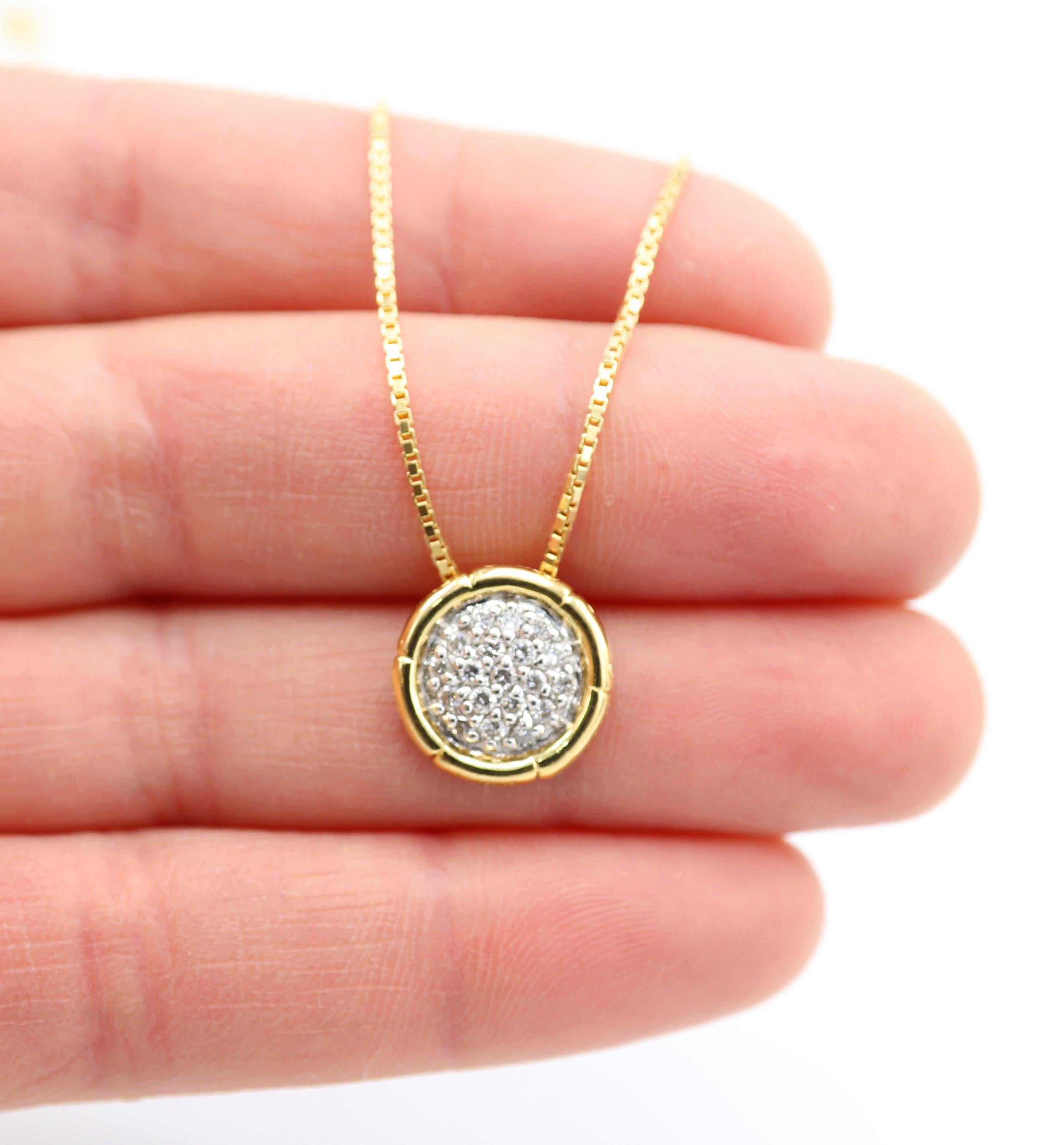 John Hardy 18 Karat Yellow Gold Bamboo Pavé Diamond Circle Pendant Necklace 
Metal: 18k yellow gold
Weight: 5.9 grams
Diamonds: Approx. .20 CTW H-I VS-SI round diamonds
Pendant: 12.5mm
Chain: Box link, 18 inches (can be adjusted to 16 inches) 
