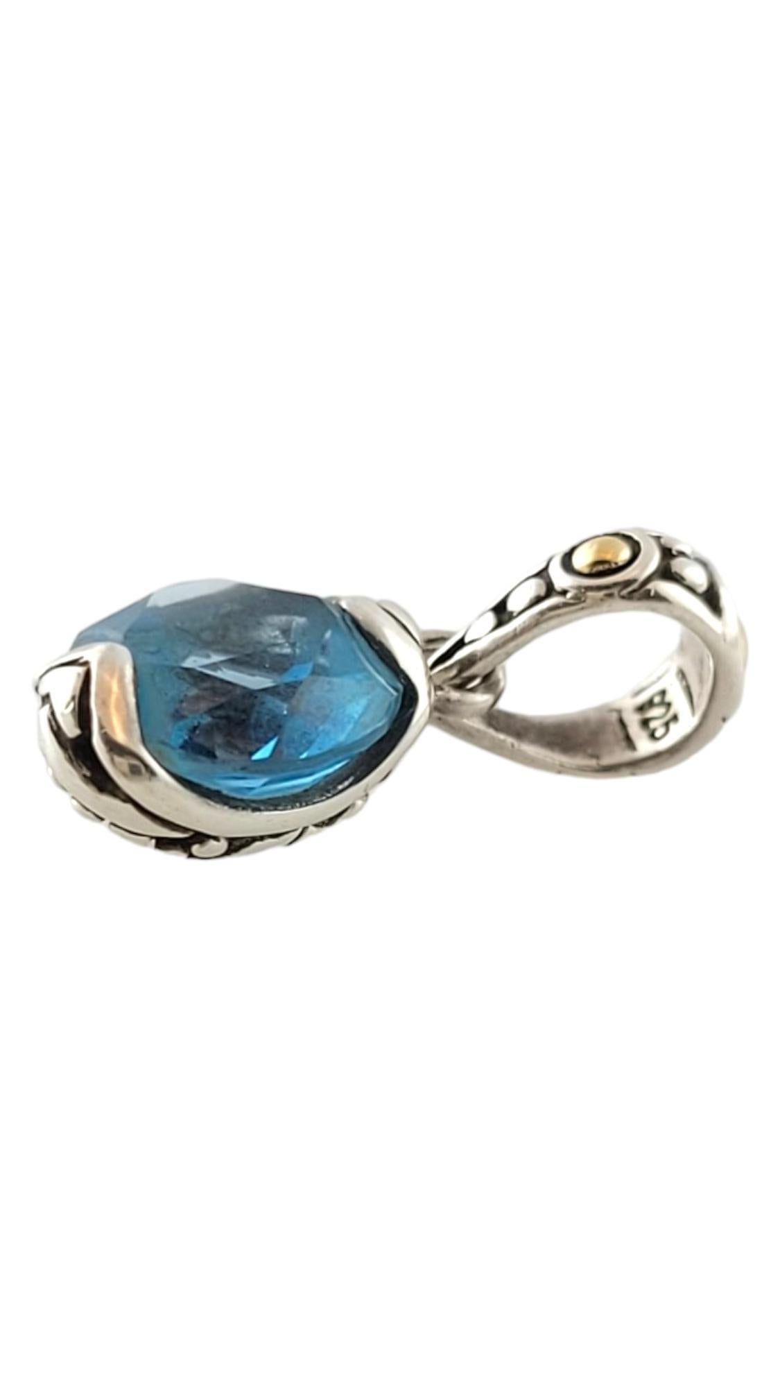 John Hardy 18K Yellow Gold/ Sterling Silver Blue Topaz Pendant

This stunning sterling silver pendant by designer John Hardy was crafted with beautiful 18K yellow gold detailing and a breath-taking blue topaz stone in the center to make you