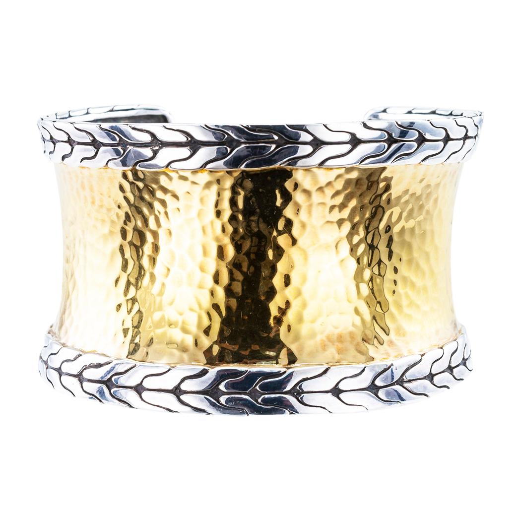 John Hardy 22 karat gold and sterling silver wide cuff bracelet.

DETAILS:

METAL:  sterling silver and 22-karat yellow gold.

WEIGHT:  62.0 grams.

HALLMARKS:  maker’s marks for John Hardy.

MEASUREMENTS:  approximately 1 5/8 (4.10 cm) wide,
