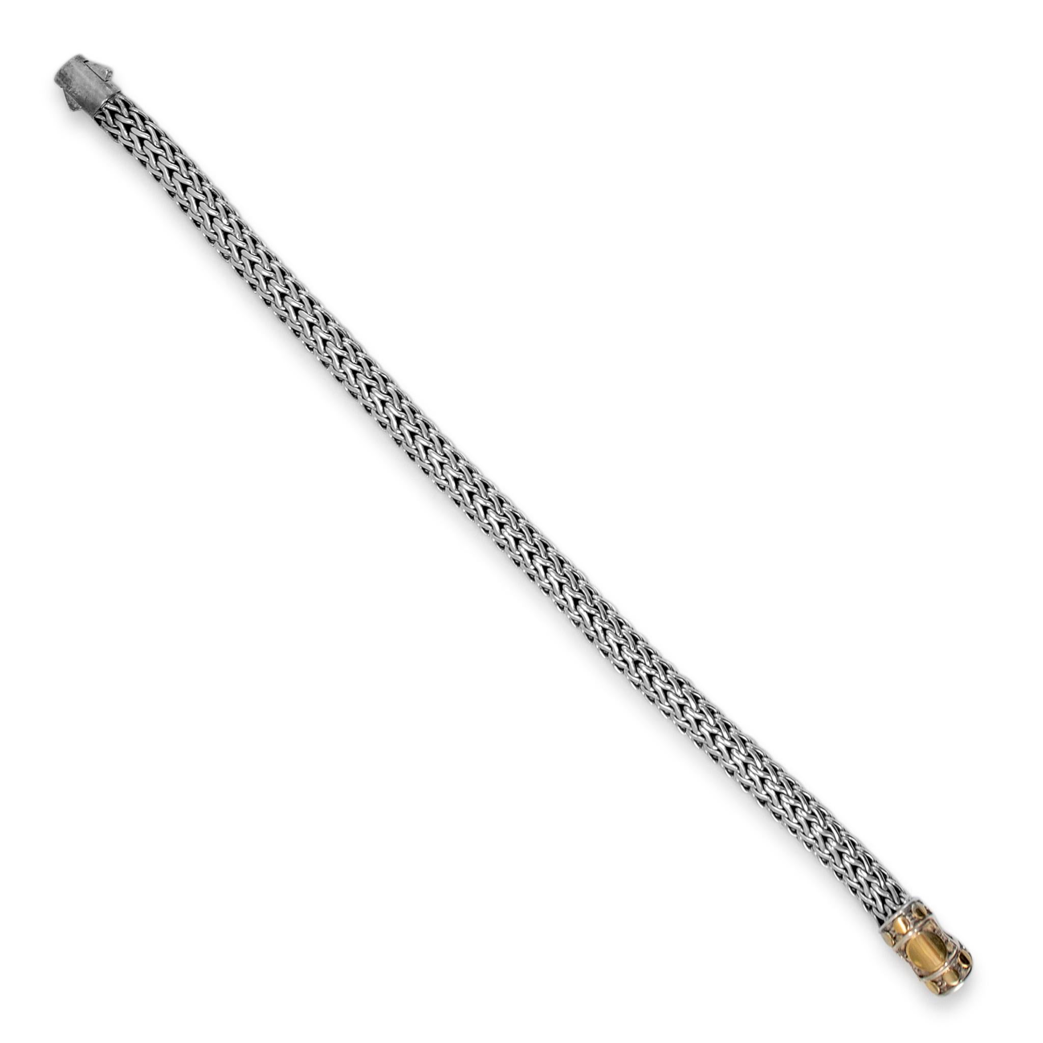 Brand: John Hardy

Metal Type: 925 Sterling Silver & 18K Yellow Gold

Length: 6.50 inches

Width: 6.50 mm

Weight: 26.86 grams

Silver and 18K yellow gold, link bracelet. The metals were tested and determined to be 925 (STERLING) silver and 18 Karat