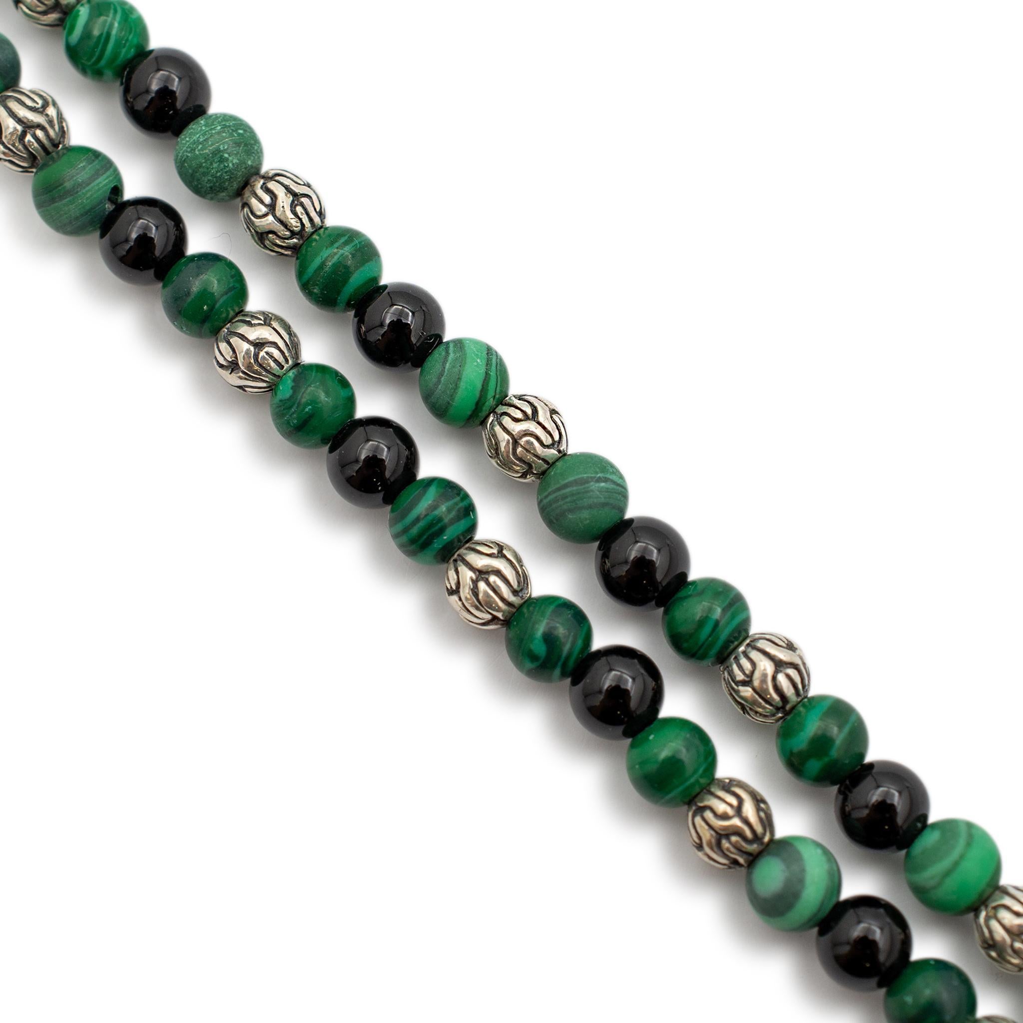 Gender: Ladies

Metal Type: 18K White Gold

Length: 19.5 inches to 23 inches

Width: 4.30 mm

Diameter: 11.30 mm

Weight: 21.30 grams

One designer silver single strand onyx and malachite bead necklace. The metal was tested and determined to be 925