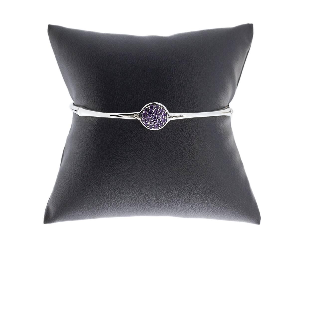 Each piece of John Hardy jewelry has been crafted in Bali since 1975. John Hardy is dedicated to creating timeless one-of-a-kind pieces that are brilliantly alive. 

This sterling silver amethyst bangle bracelet is from John Hardy's Bamboo