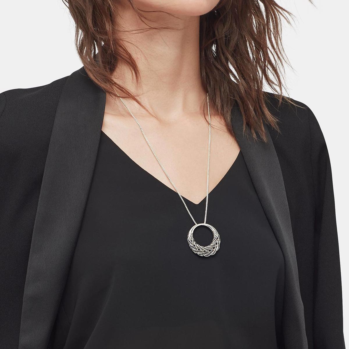 This new John Hardy open circle pendant necklace was handcrafted with the classic chain motif in sleek sterling silver. It features pave set black sapphire and black spinel stones. The pendant is on 32