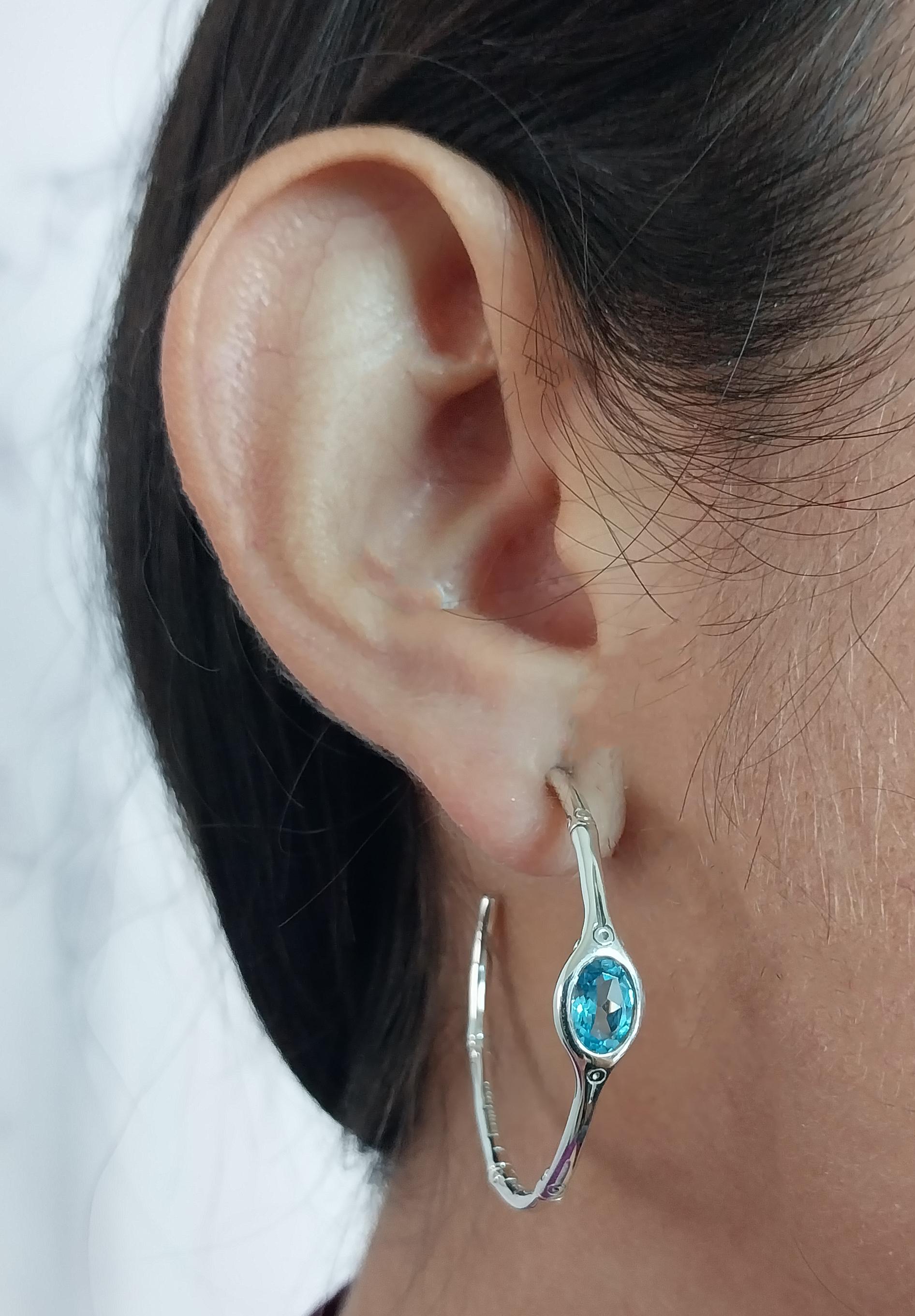 John Hardy Bamboo Hoop Earrings Crafted in Sterling Silver Featuring 2 Oval Blue Topaz. 1.5 Inch Diameter. Pierced Post with Large Friction Back. $450 MSRP.