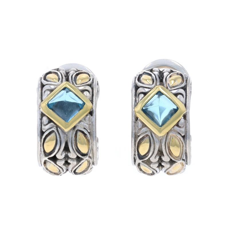 Brand: John Hardy

Metal Content: Sterling Silver & 18k Yellow Gold

Stone Information

Natural Topaz
Treatment: Routinely Enhanced
Cut: Pyramid Cabochon
Color: Blue

Style: Half-Hoop
Fastening Type: Omega Closures

Measurements

Tall: 11/16
