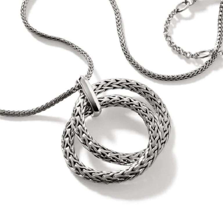 Interlink pendant necklace from John Hardy. Sterling silver interlocking pendant which slides along a woven, 1.8mm chain. Adjustable necklace from 16-18