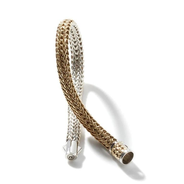 Inspired by ancient Balinese weaving tradition, sterling silver and 18 karat yellow gold are hand-woven into a supple, reversible bracelet. 6.5 inches long.

Color: Silver-tone
Model: BZ904RVXUM
Bracelets: 1 band
Material: Sterling Silver
Metal