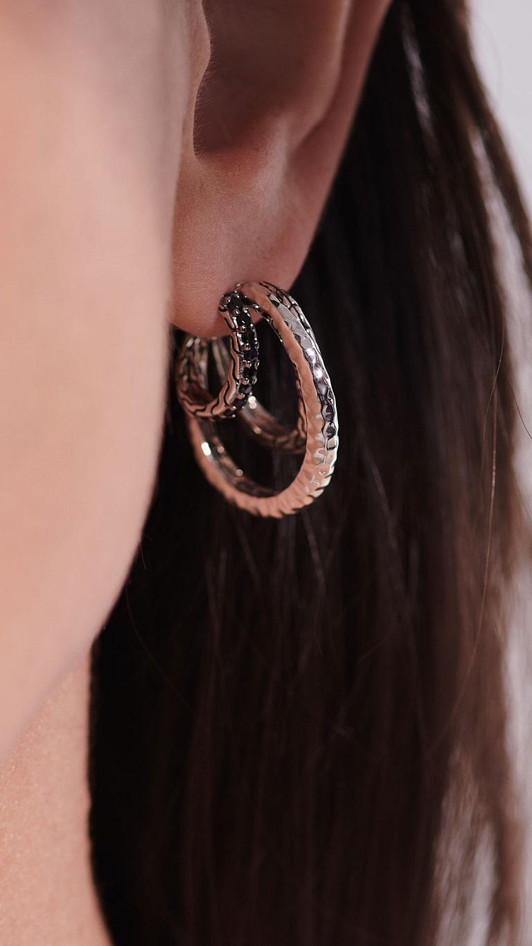 Accesorize with triple the hoops in these Classic Chain earrings by John Hardy. Featuring three individually unique rings including a stunning hammered silver for a textured touch. A touch of radiance is added with the accents of treated black