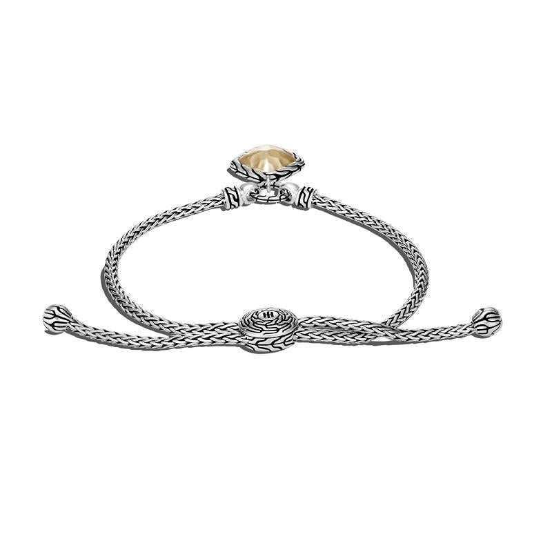Sterling Silver and 18k Bonded Yellow Gold
Bracelet measures 2.5mm wide
Charm measures 14mm x 14mm
Size Medium to Large 
BZ900072

