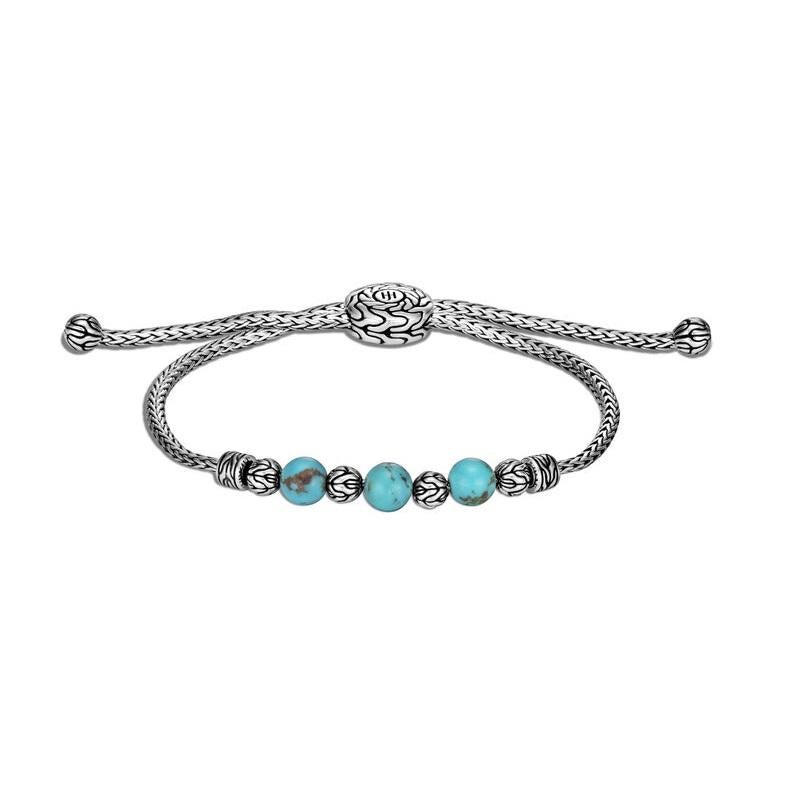 Our mini Classic Chain bracelet is punctuated with beads of turquoise. Delicate yet dynamic, its pull-through design allows you to customize the fit whether worn solo or stacked. 
Sterling Silver
Turquoise
BBS900008TQXM-L