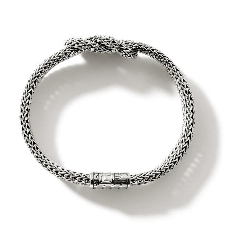 Crafted in sterling silver this Manah bracelet from John Hardy features a double row of hand woven silver that's been crafted into a knot. Features a double pressure clasp.

