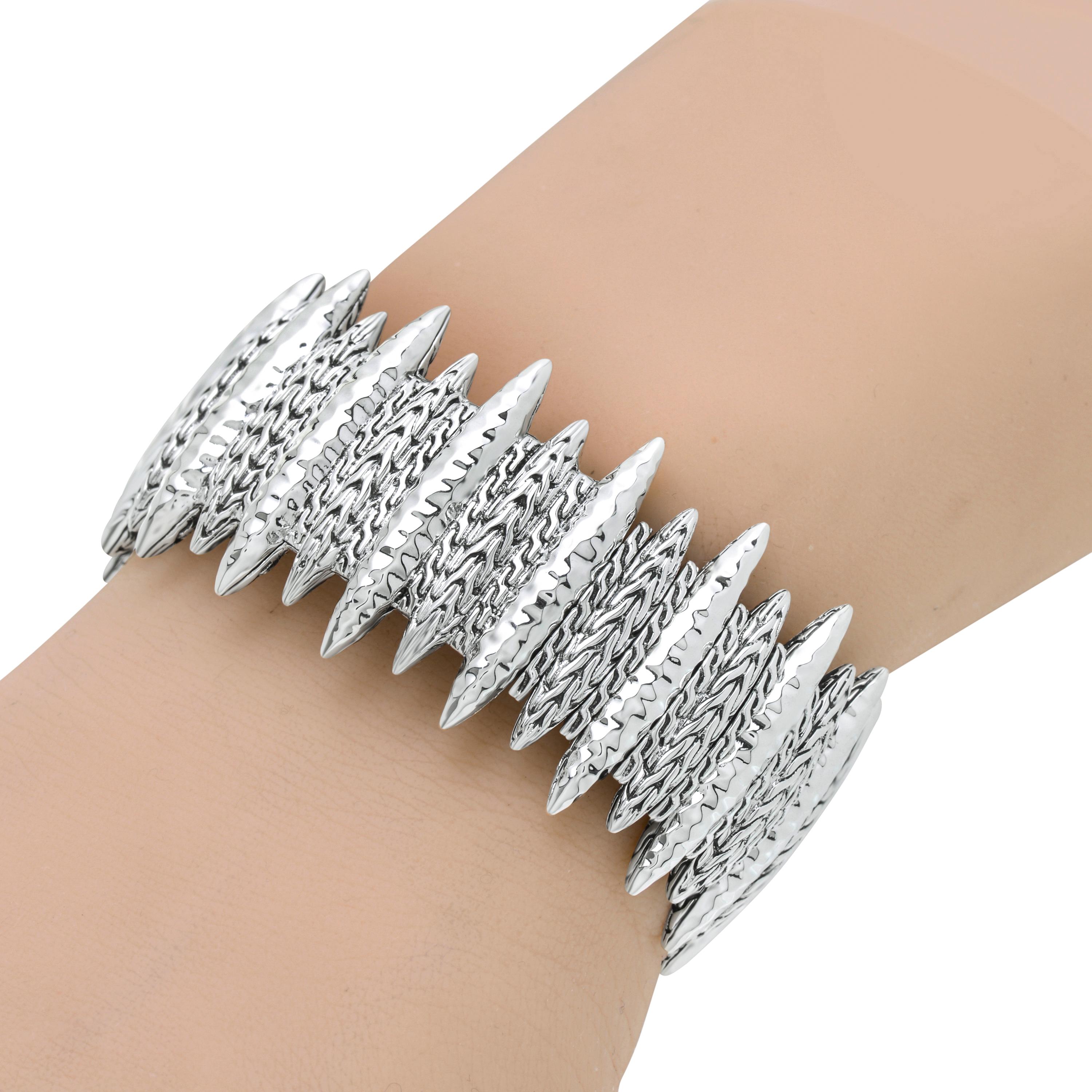 This edgy John Hardy Sterling Silver Cuff Bracelet features an adventurous pattern of spears with alternating decorations of hammered texture and John Hardy classic chain motif. Primarily inspired by jewelry making traditions in Bali, John Hardy is