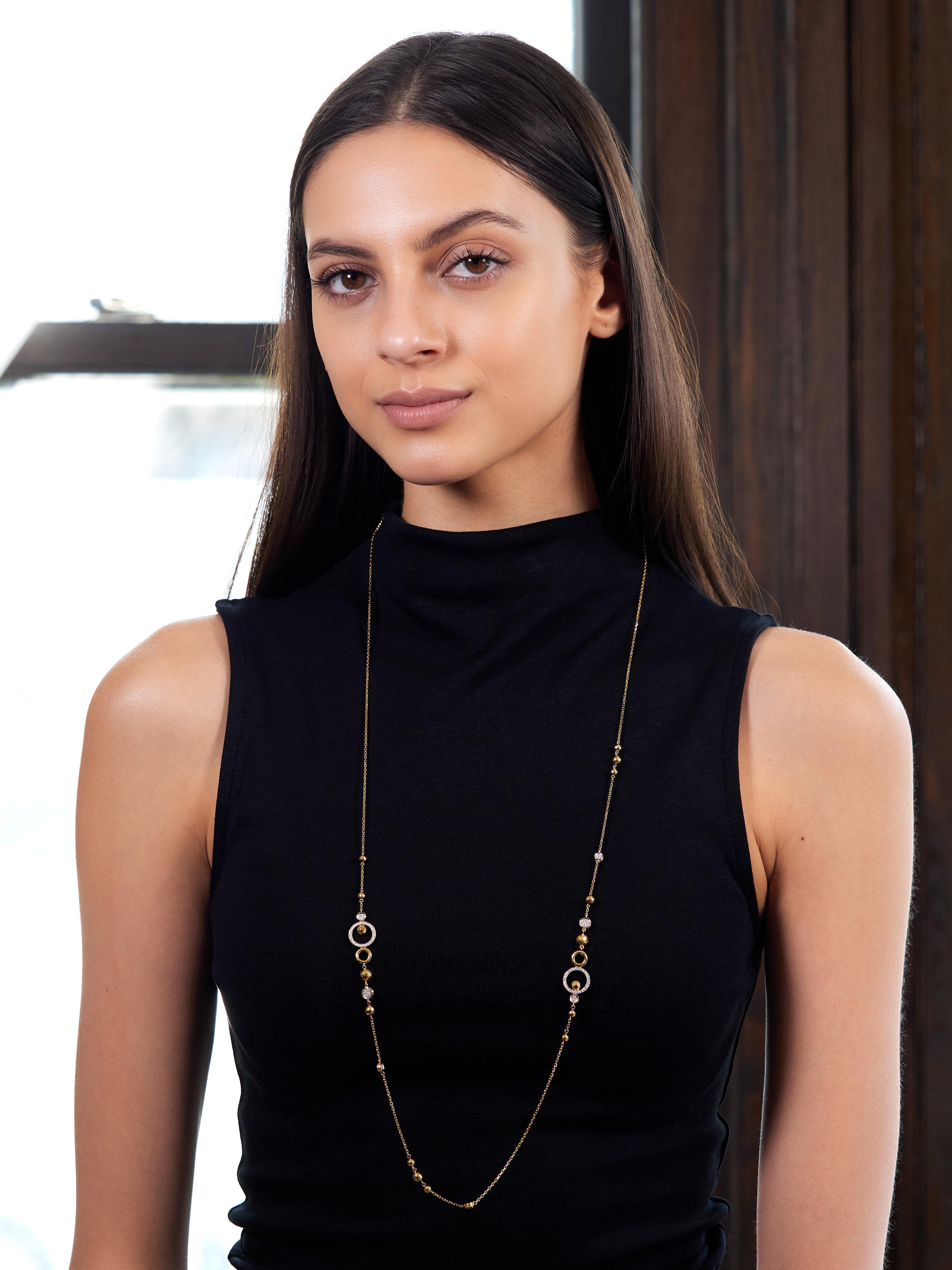 Designed as 1.0 mm cable link chain featuring clustered circle motif stations
Comprised of pierced disks, circle forms, and hammered round beads
Featuring white gold topped circle links bead set with diamonds
Round brilliant cut and weighing