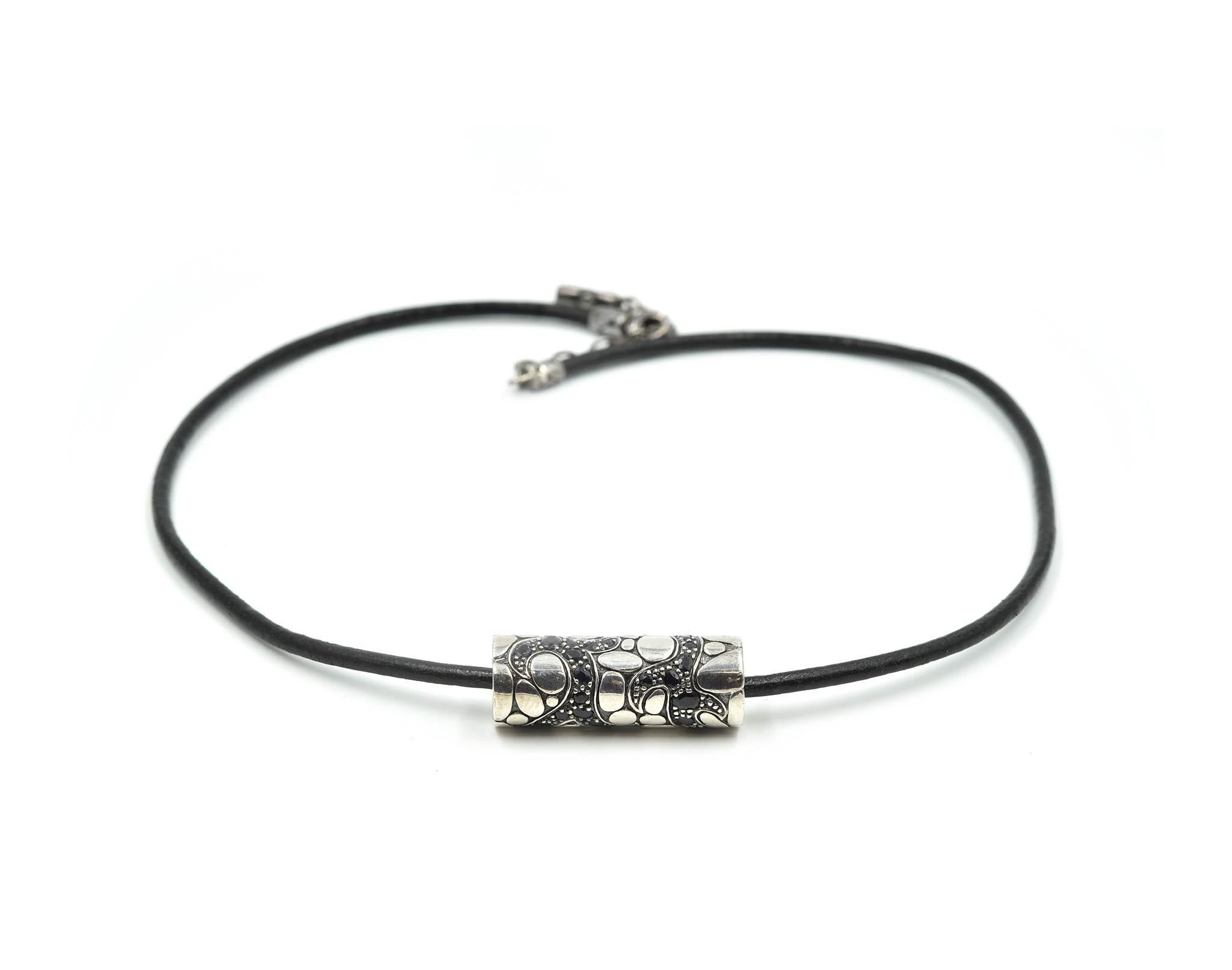 Designer: John Hardy
Material: sterling silver and woven leather cord
Dimensions: necklace measures 19-inches long and is a 1/8-inches wide
Weight: 22.60 grams
