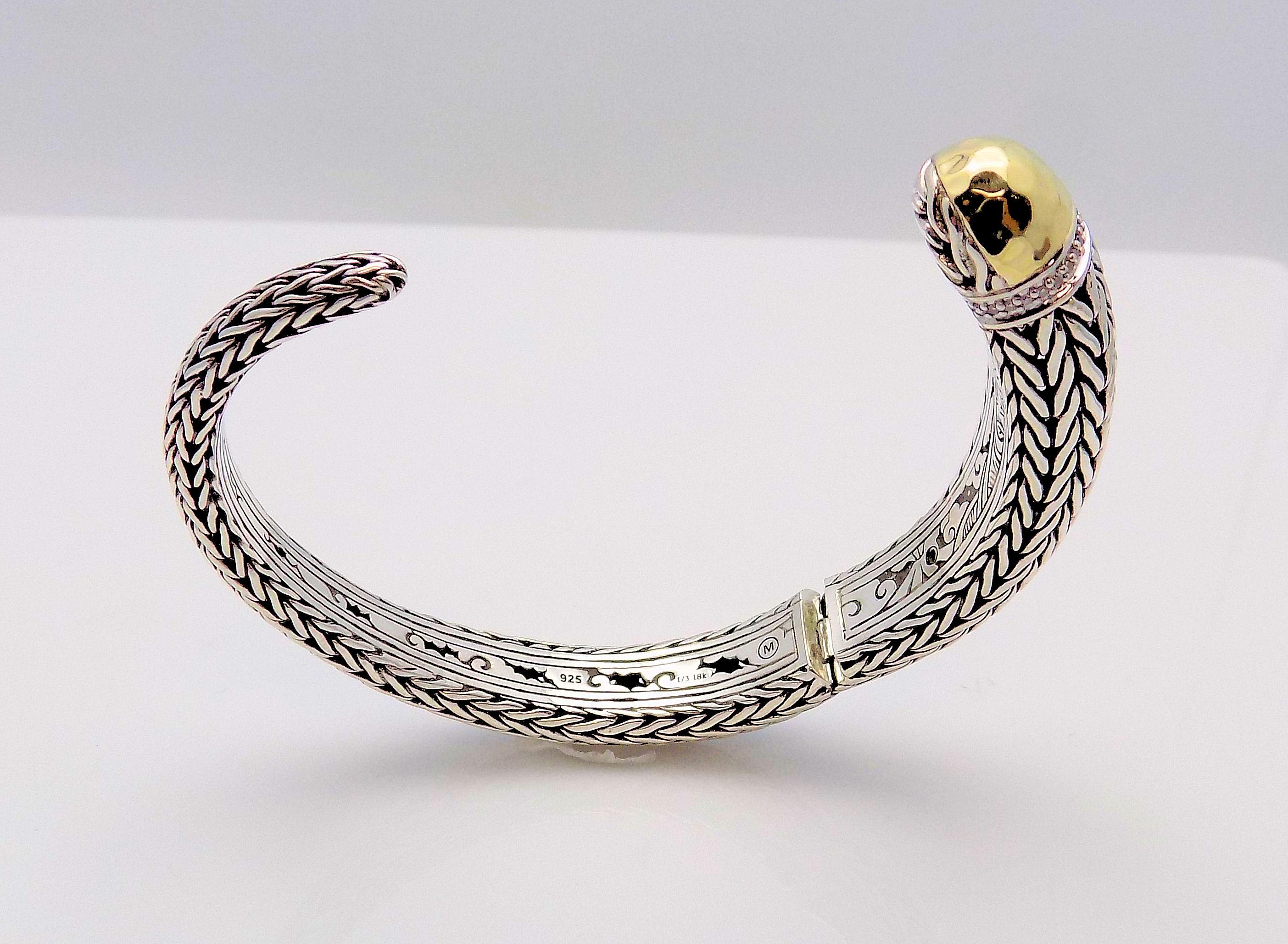 Presenting a Limited Edition, Artisan Handcrafted Sterling Silver and 18 Karat Yellow Gold Kick Cuff Bracelet with Diamond Banded and Hammered, Gold End Cap featuring 18 Round Brilliant Diamonds 0.09 Carat Total Weight, SI, H. This is the Classic