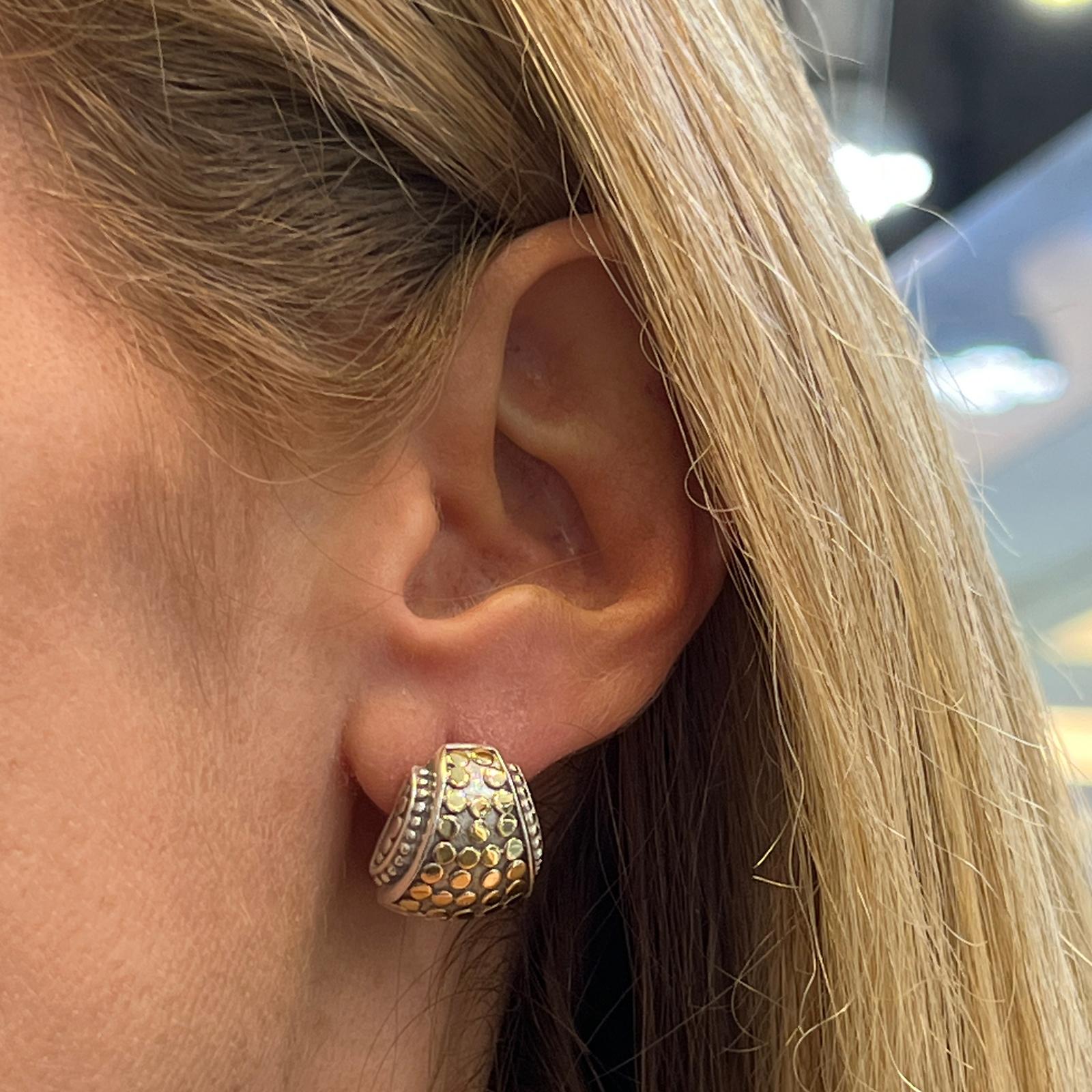 John Hardy earrings, from the Dot Collection, fashioned in 18 karat yellow gold and sterling silver. The lightweight earrings are great for everyday measuring .60 x .60 inches with lever-backs. Signed JH 18k 925.