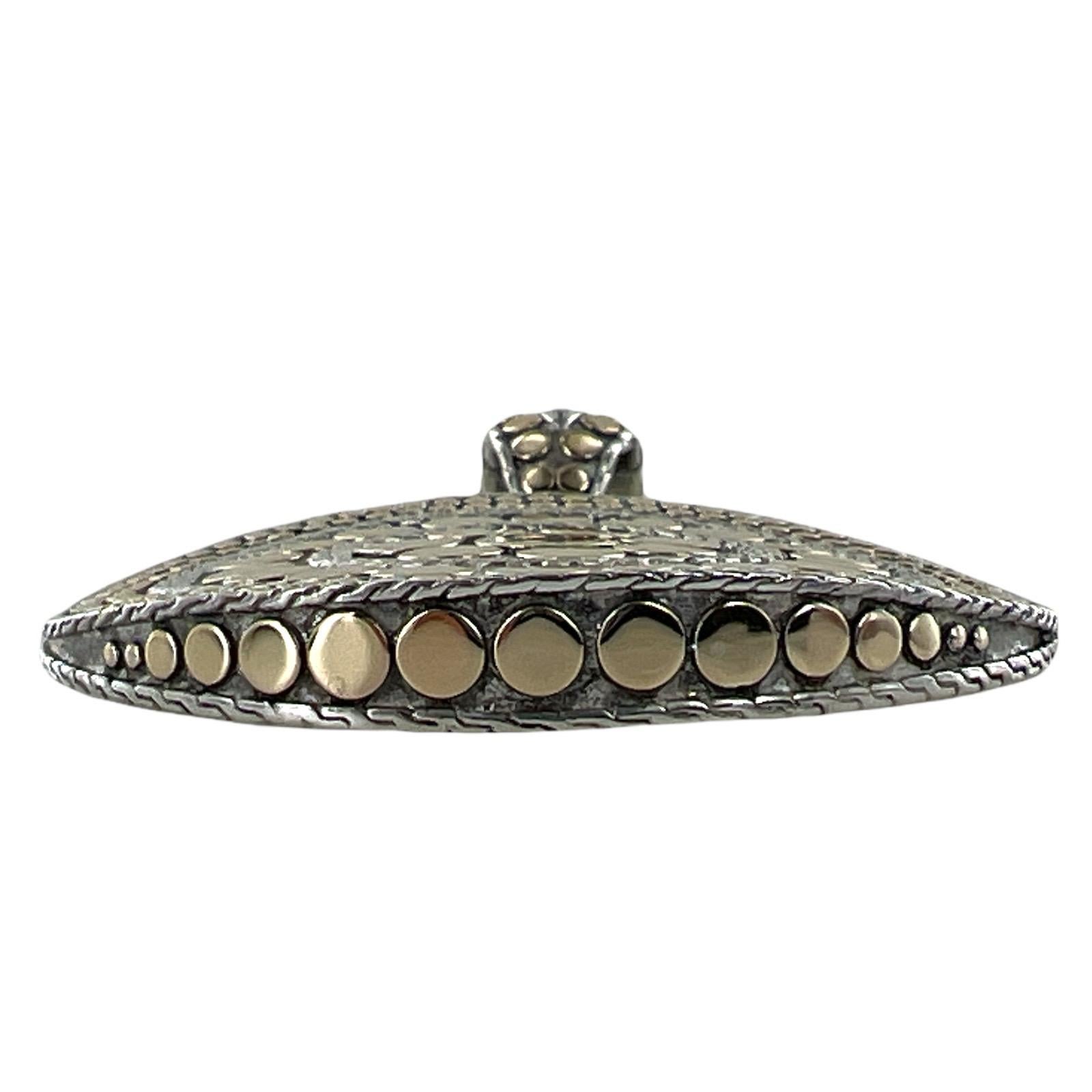 John Hardy large pendant enhancer fashioned in 18 karat yellow gold and sterling silver. The pendant is part of the Dot Collection, measures 2.00 inches in diameter, and is signed JH 18K 925. The baile measures .75 inches, adding to the length of