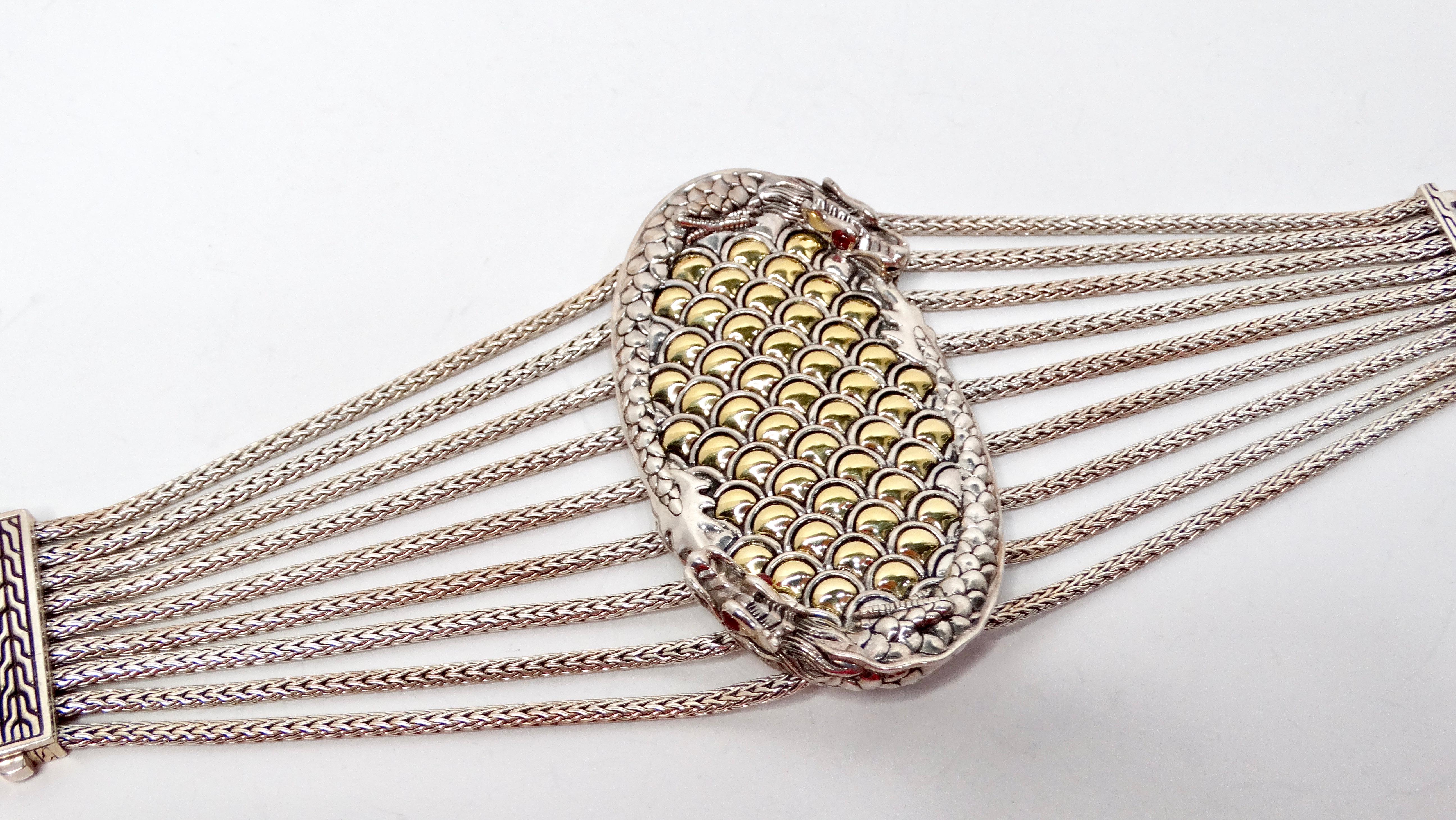Introducing the exquisite John Hardy Dragon Motif Pendant Bracelet, a stunning blend of artistry and elegance. This unique piece features a striking central oval pendant adorned with two intricately designed dragons that gracefully wrap around it.