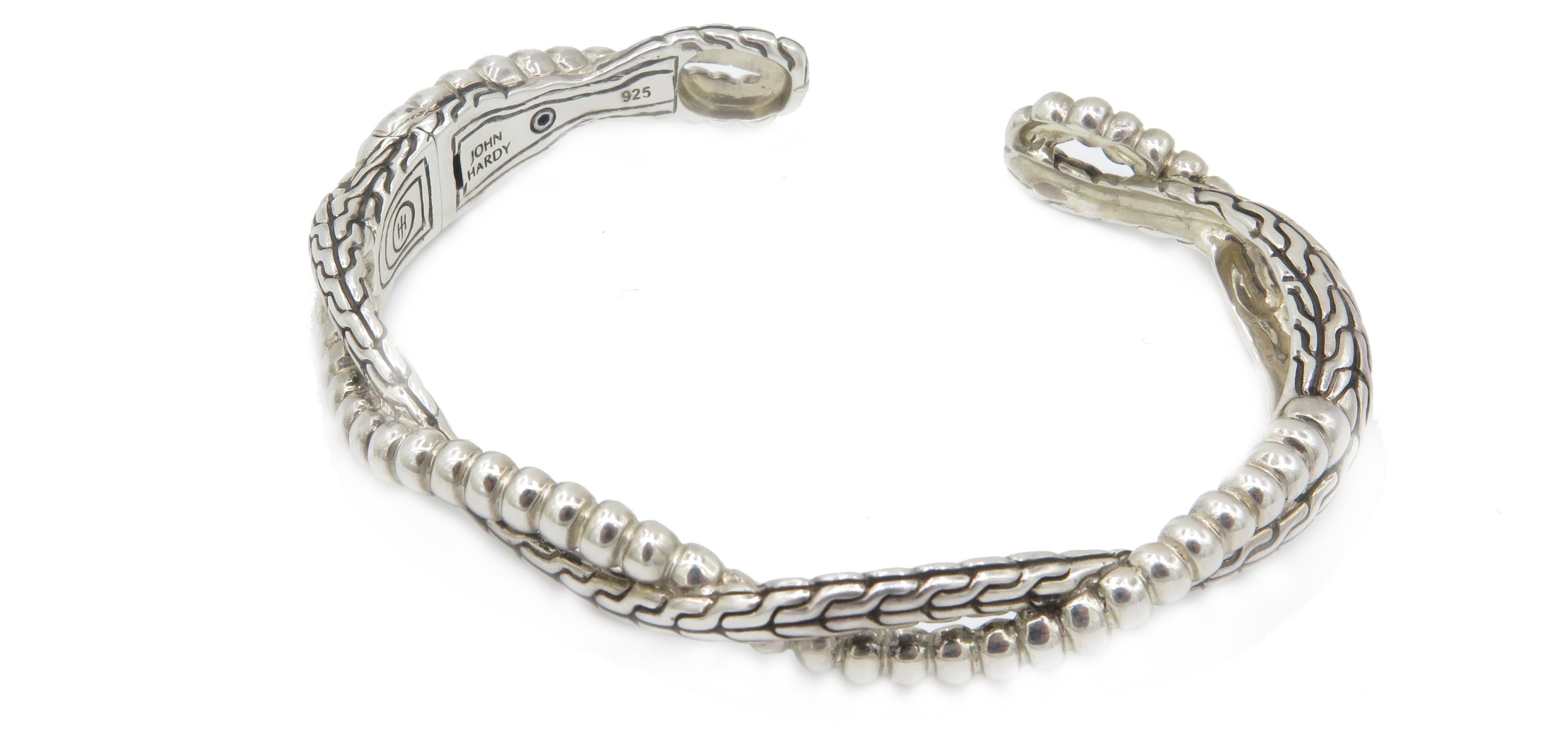 A, beautiful lovely etched crossover design bracelet in 925 sterling silver. This, lovely 7in bracelet is by John Hardy. Who, is widely known for his amazing craftsmanship and silver jewelry. John Hardy's, creative influences comes his natural