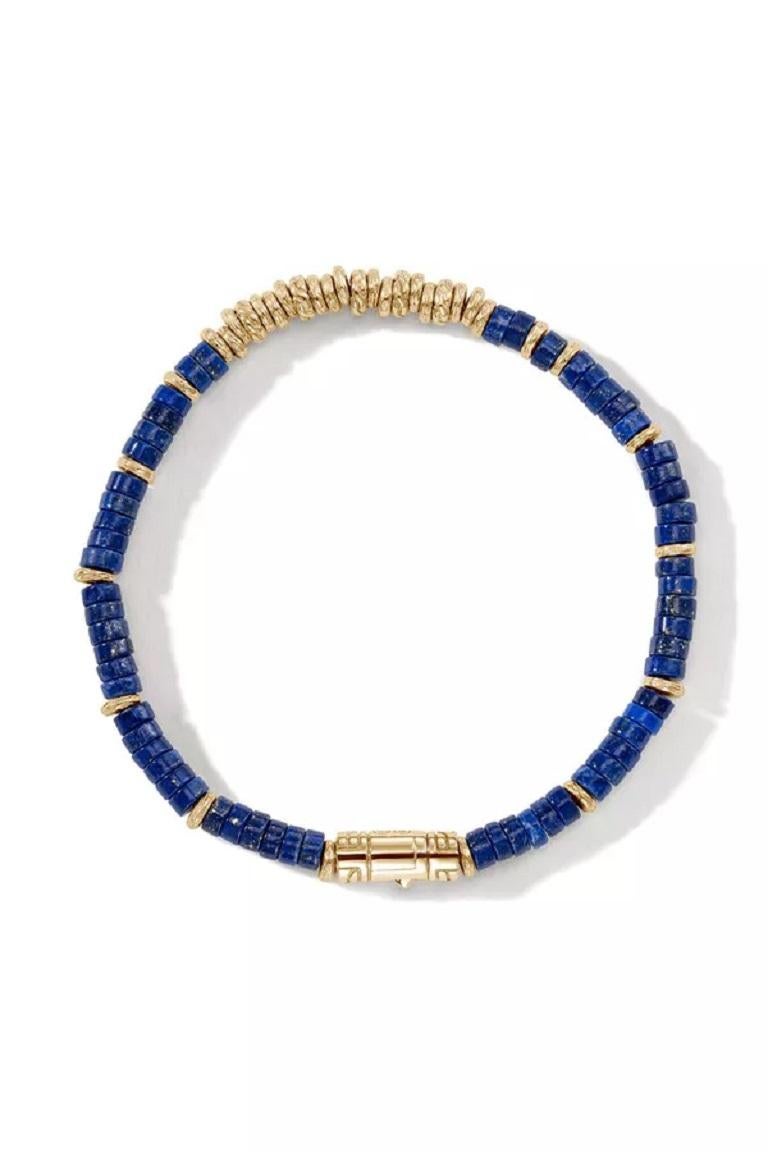 John Hardy's bracelet is strung with scores of vibrant lapuis lazuli beads. The rich blue hue pops against the 14kt yellow gold.

Style No.: BUGGS900984LPZXU
Metal: 14K Yellow Gold
Gauge: 4MM
Closure: Pusher Clasp