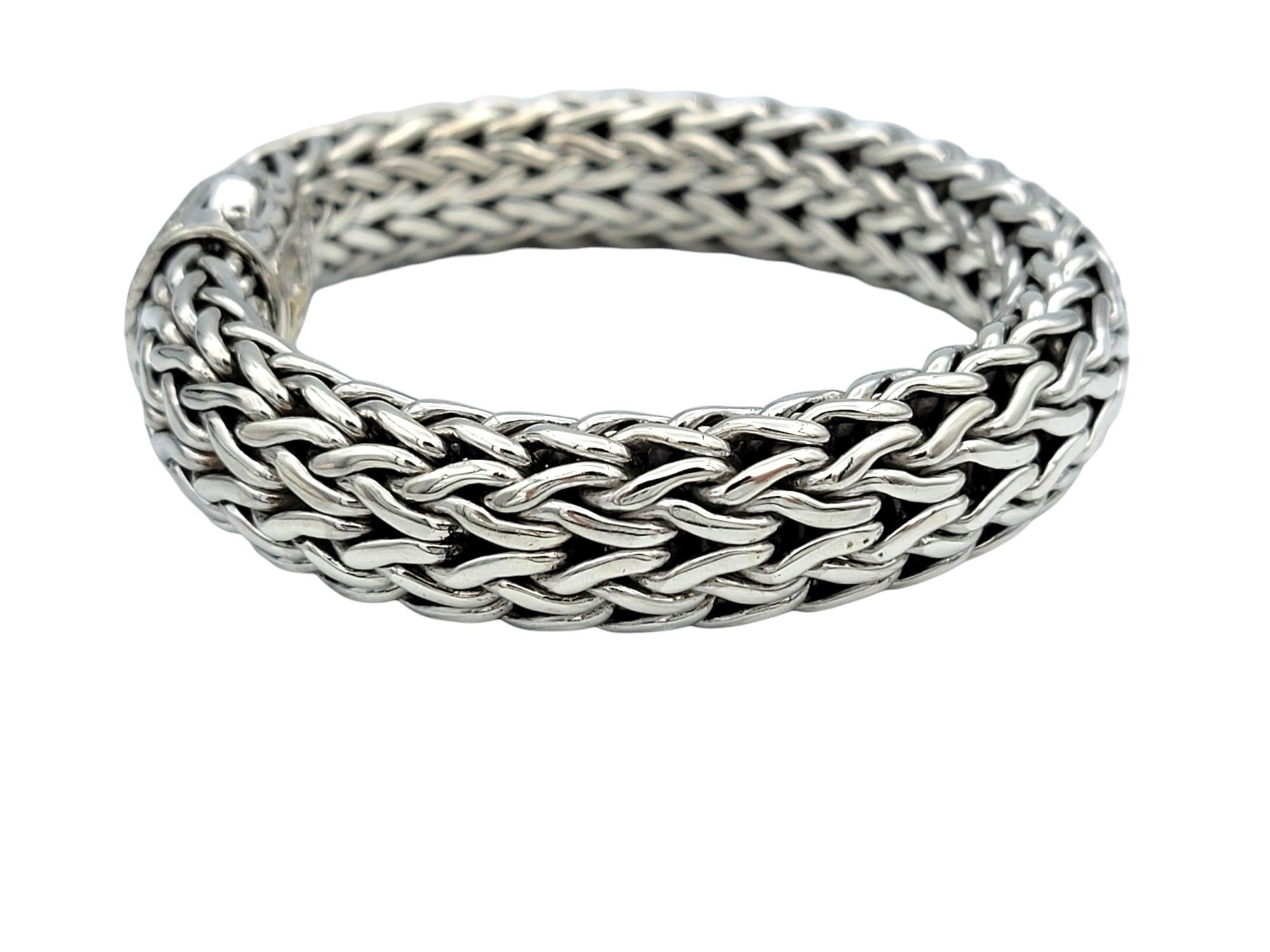 The inner circumference of this bracelet measures 6.5 inches and will comfortably fit up to a 6.25 inch wrist. 

Crafted with meticulous attention to detail, the John Hardy Icon bracelet showcases sterling silver in a woven design, exuding timeless