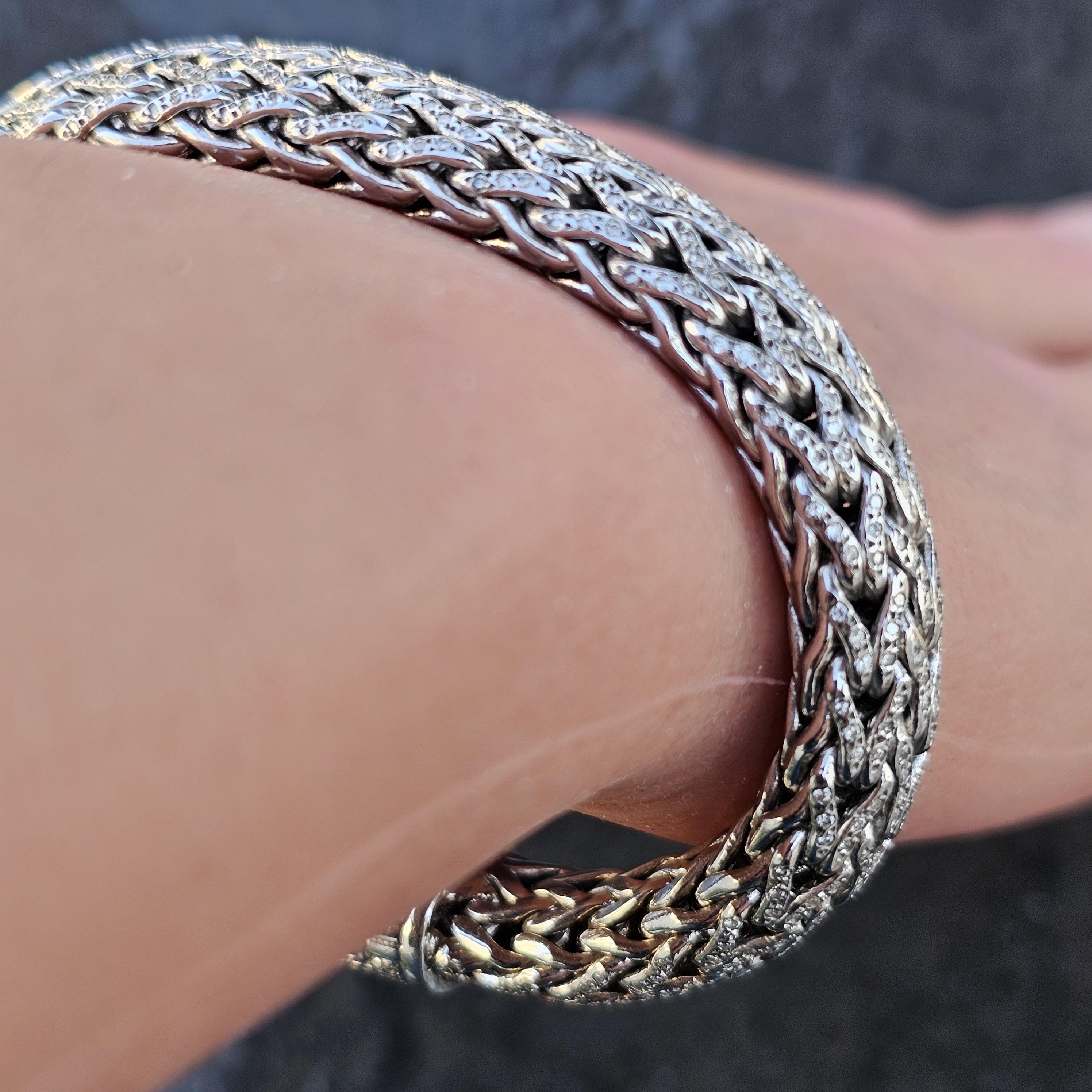 This stunning Icon John Hardy chain bracelet is crafted in sterling silver and 18k gold, it features round white diamonds totaling 3.67 carats. The bracelet measures 7.25 inches in length and 10.5 mm in width. Current retail price is $21,500. 

More