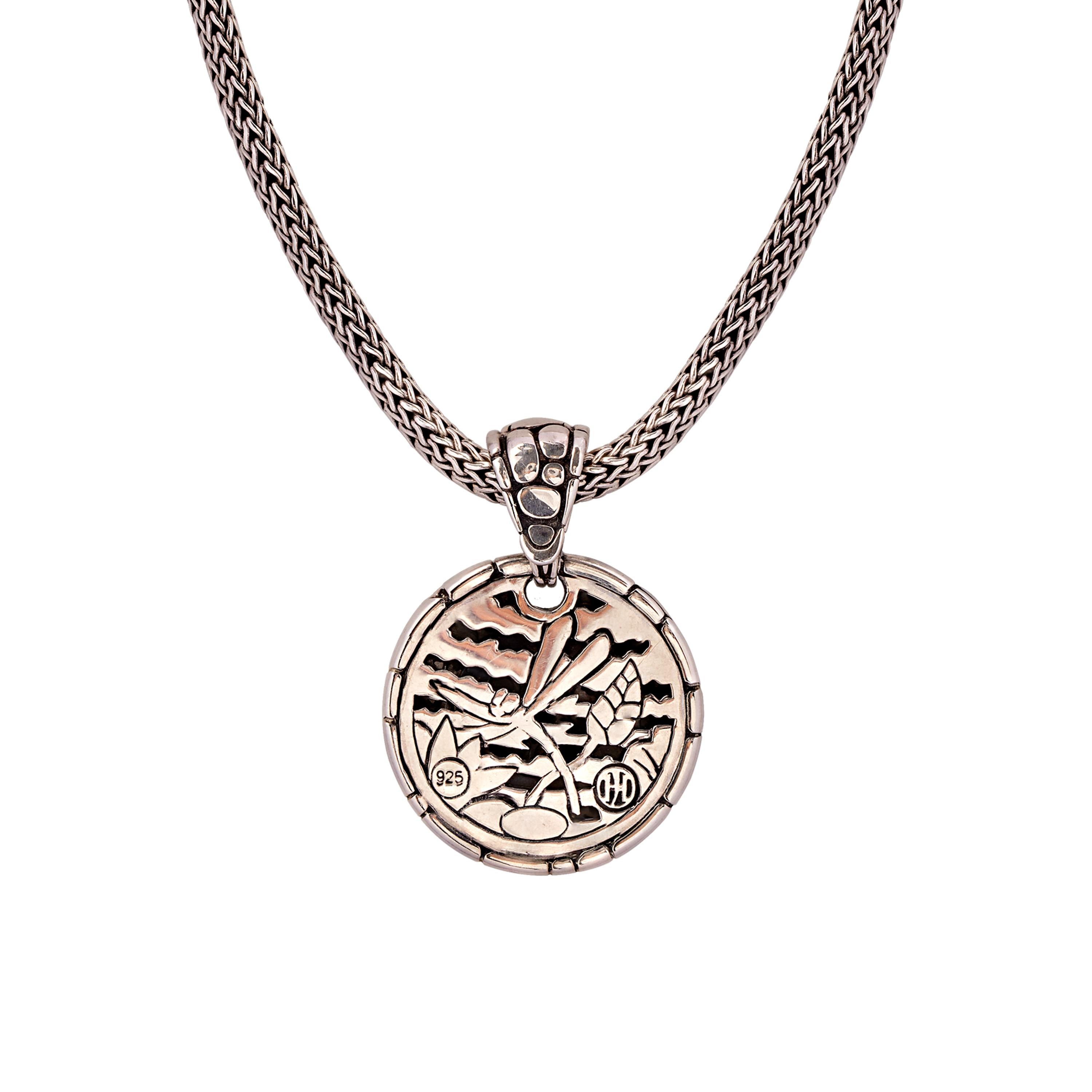 This versatile set by designer John Hardy combines his signature 5 mm wheat chain with a round sterling silver “Kali” chain enhancer. The pebbled design on the front of the pendant reverses to a lovely and detailed depiction of a dragonfly and leaf