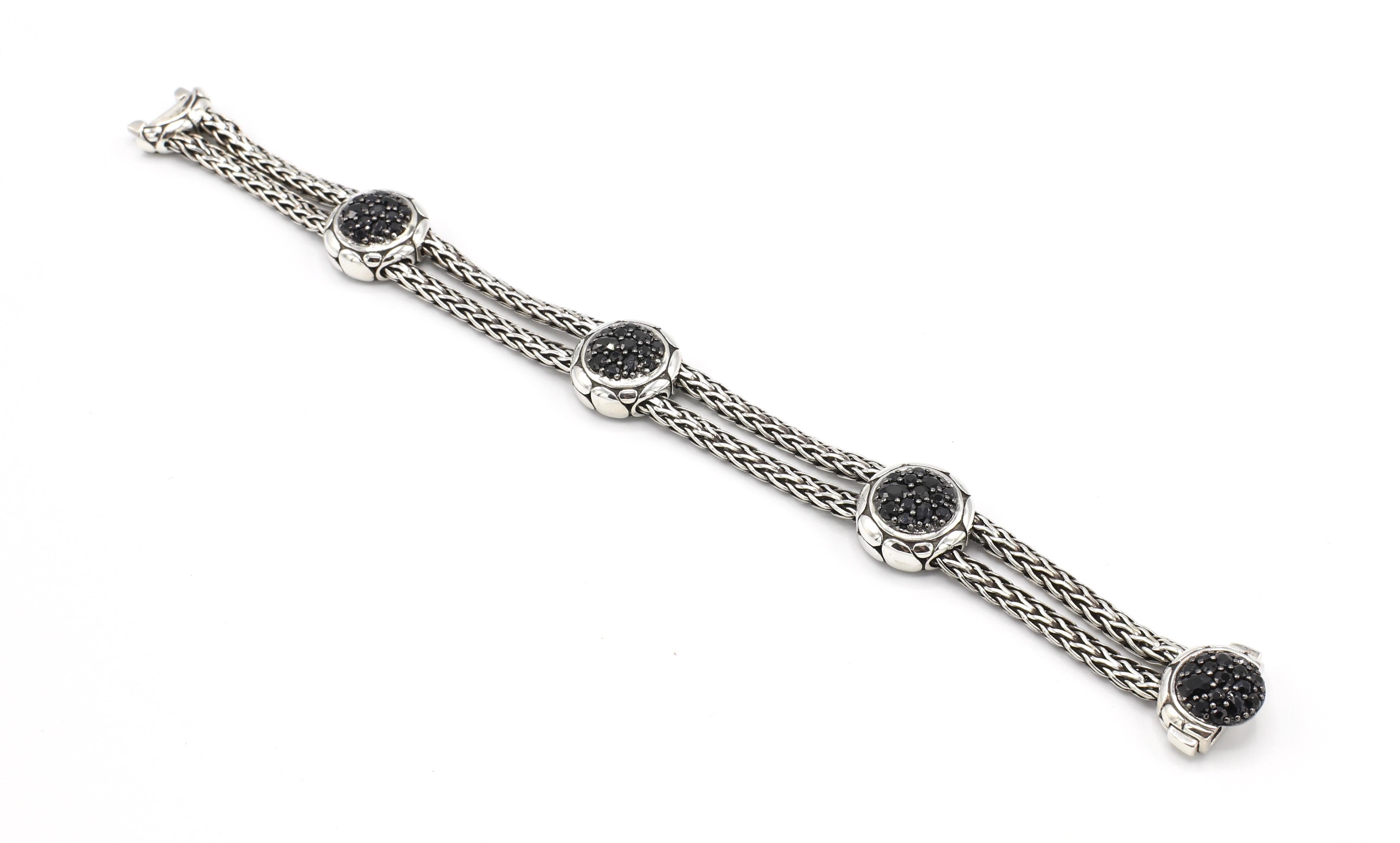 John Hardy Kali Sterling Silver Pure Lava Fire Four Station Bracelet with Black Sapphire

Metal: Sterling Silver
Weight: 30.7 grams 
Gemstone: Black sapphires 
Length: 7.25 inches
Width: 15mm 
Clasp: Push clasp
Signed: 925 with JH hallmark
Retail: