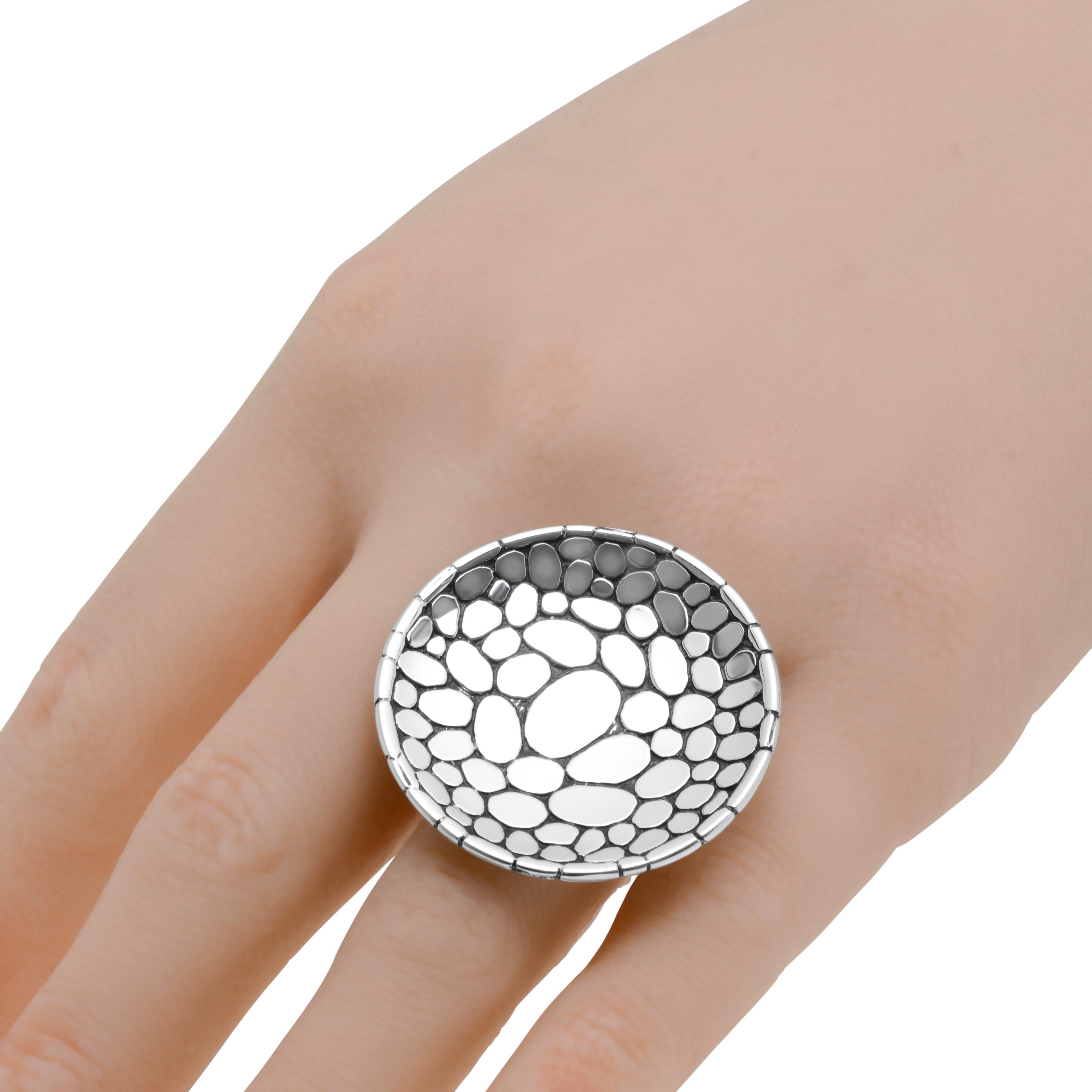 This bold John Hardy Sterling Silver Statement Ring features a hand carved pebble design lining a decorative circle. Primarily inspired by jewelry making traditions in Bali, John Hardy is celebrated for handcrafted and one-of-a-kind collections that