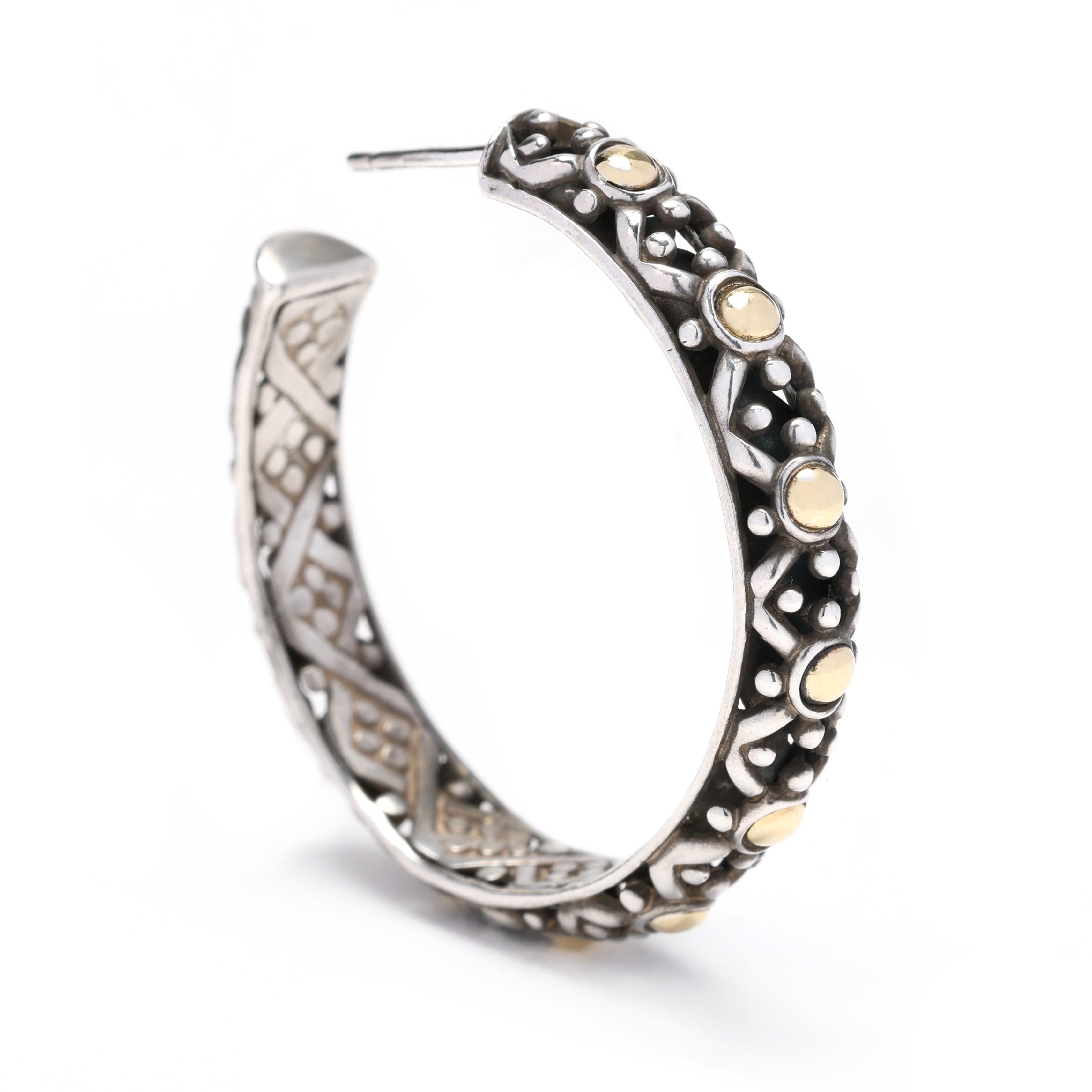 These John Hardy large dot hoops are a striking pair of earrings that will add a touch of sophistication to any outfit. Made from 18k yellow gold and sterling silver, these hoop earrings feature an intricate dot pattern that gives them a unique and
