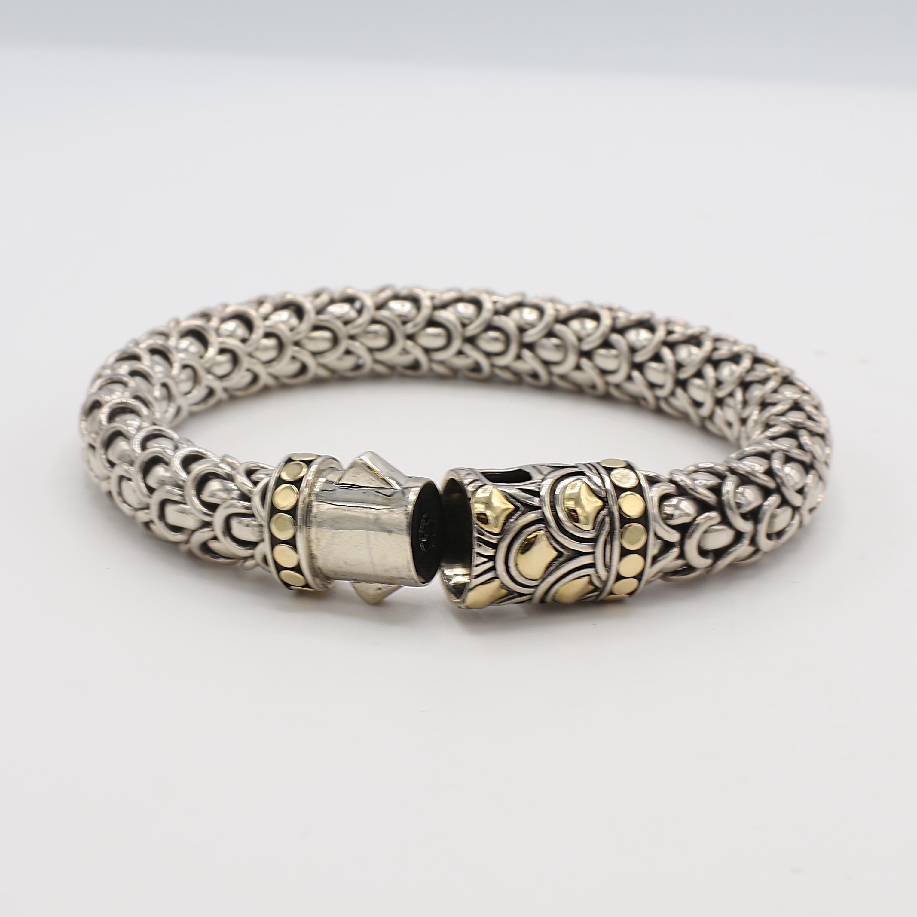John Hardy Legenda Naga Scale Sterling Silver & 18K Yellow Gold Bracelet 
Metal: Sterling silver & 18k yellow gold
Weight: 89 grams
Width: 10.5mm
Length: 8.25