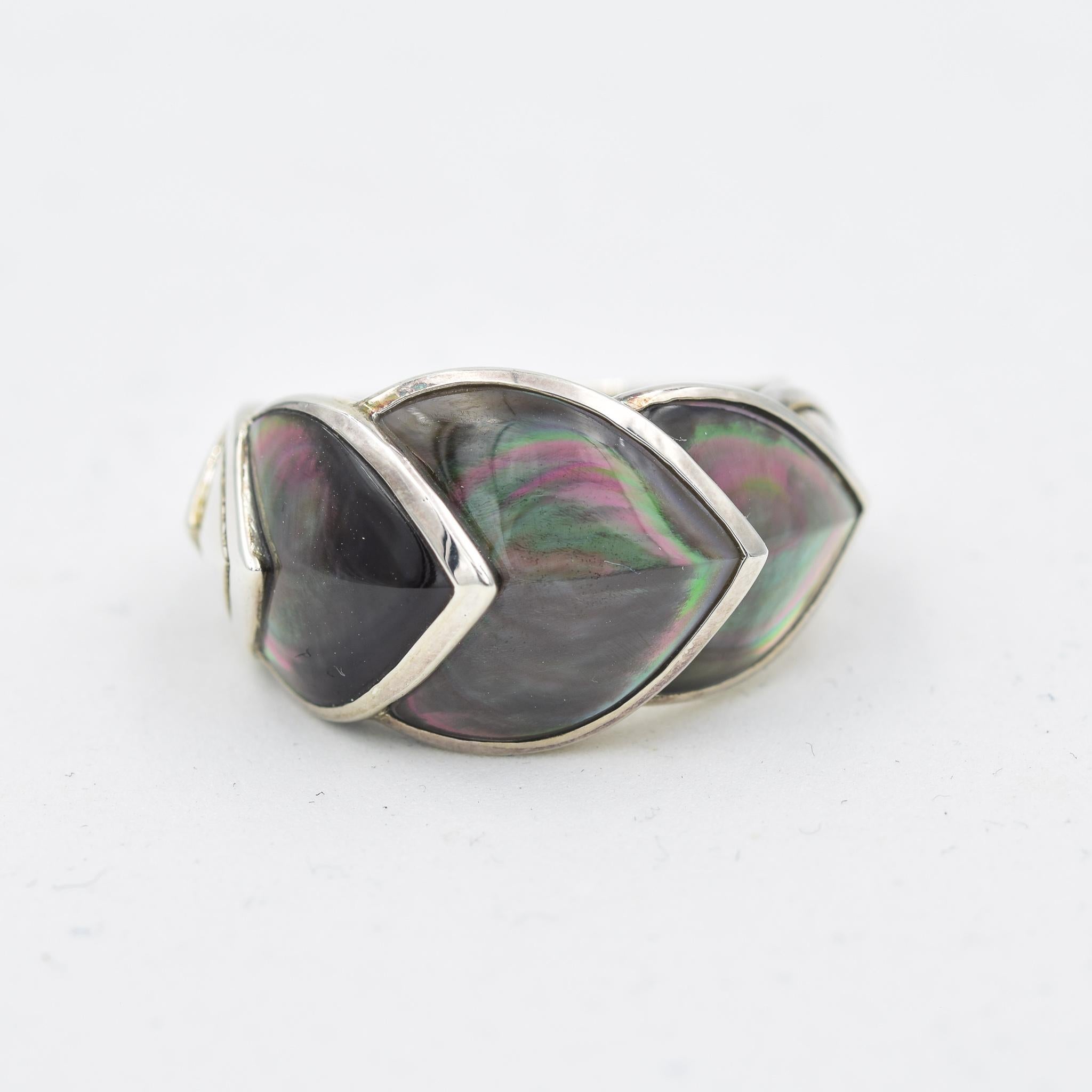 Make a statement with this ring from John Hardy's Legends Naga collection with a stylized scale design. Handcrafted in sterling silver, the statement-making piece of jewelry features a row of shimmering gray Mother-of-Pearl. The inner design was