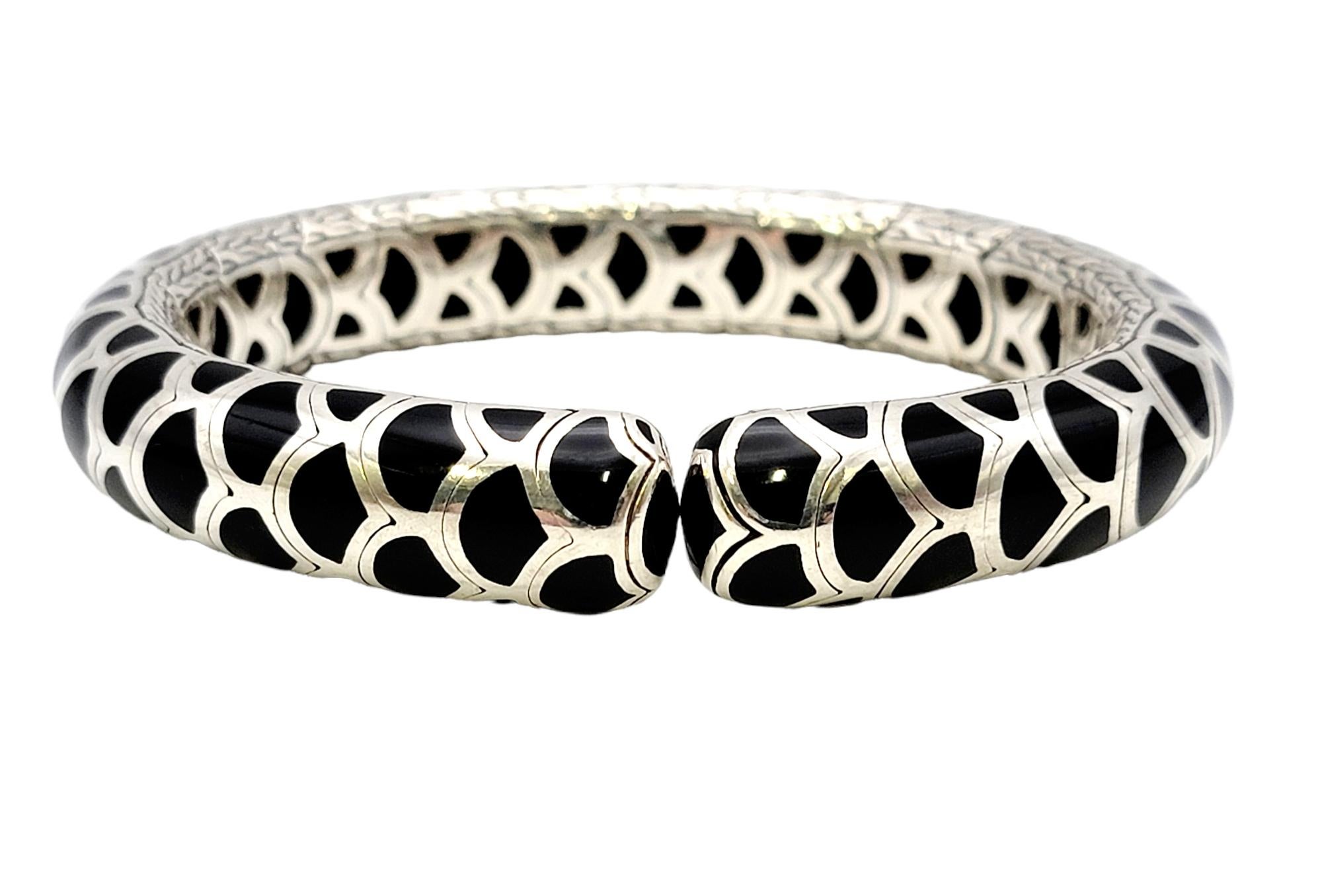 Sleek modern cuff bracelet by popular designer, John Hardy. This contemporary piece can be stacked with other bracelets for a more fashion-forward look, but is certainly substantial and lovely enough to wear on its own. The chic bracelet is made of