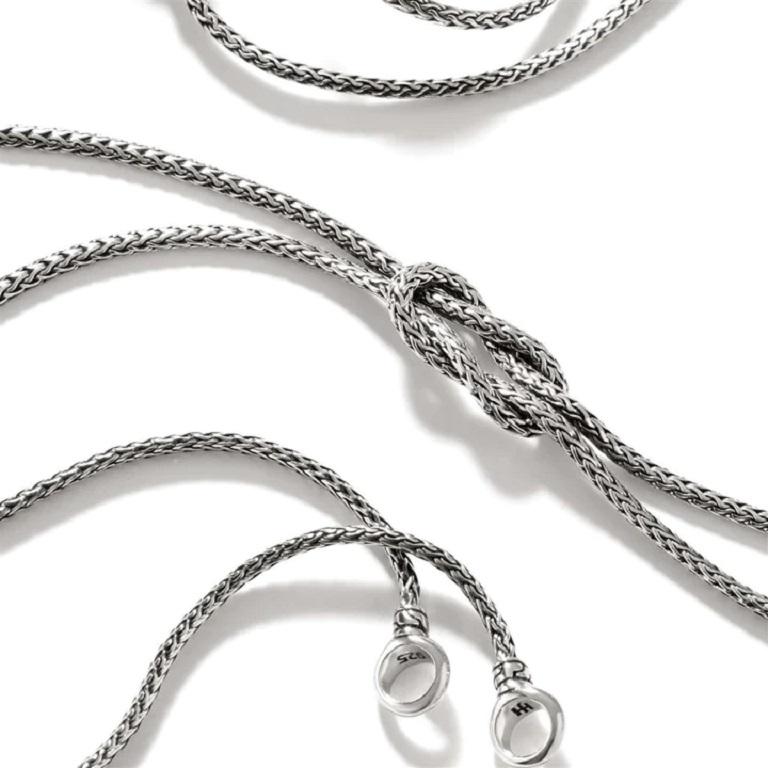 This enchanting love knot necklace by John Hardy can be transformed from a double wrapped 18 inch chain to a 24 inch lariat style necklace.

Gender: Unisex
Collection: Classic Chain, Manah
Metal: 925-Sterling Silver
Metal Color: Silver
Sizing: 18