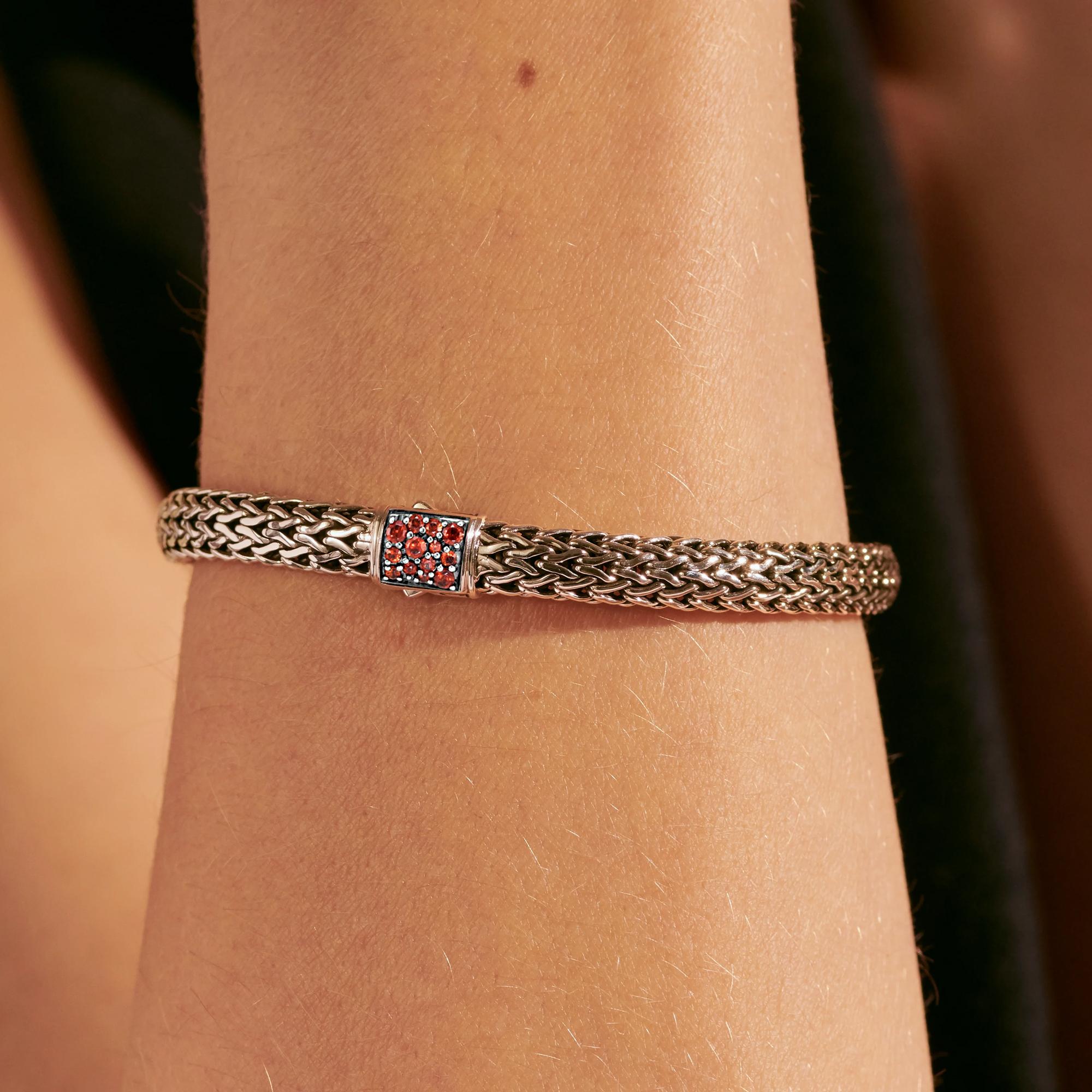 Taking 9 hours to cast, weave & finish by hand, our most iconic design distills the complex art of chain-weaving into a stunningly simple form.

The bracelet measures 7 1/4