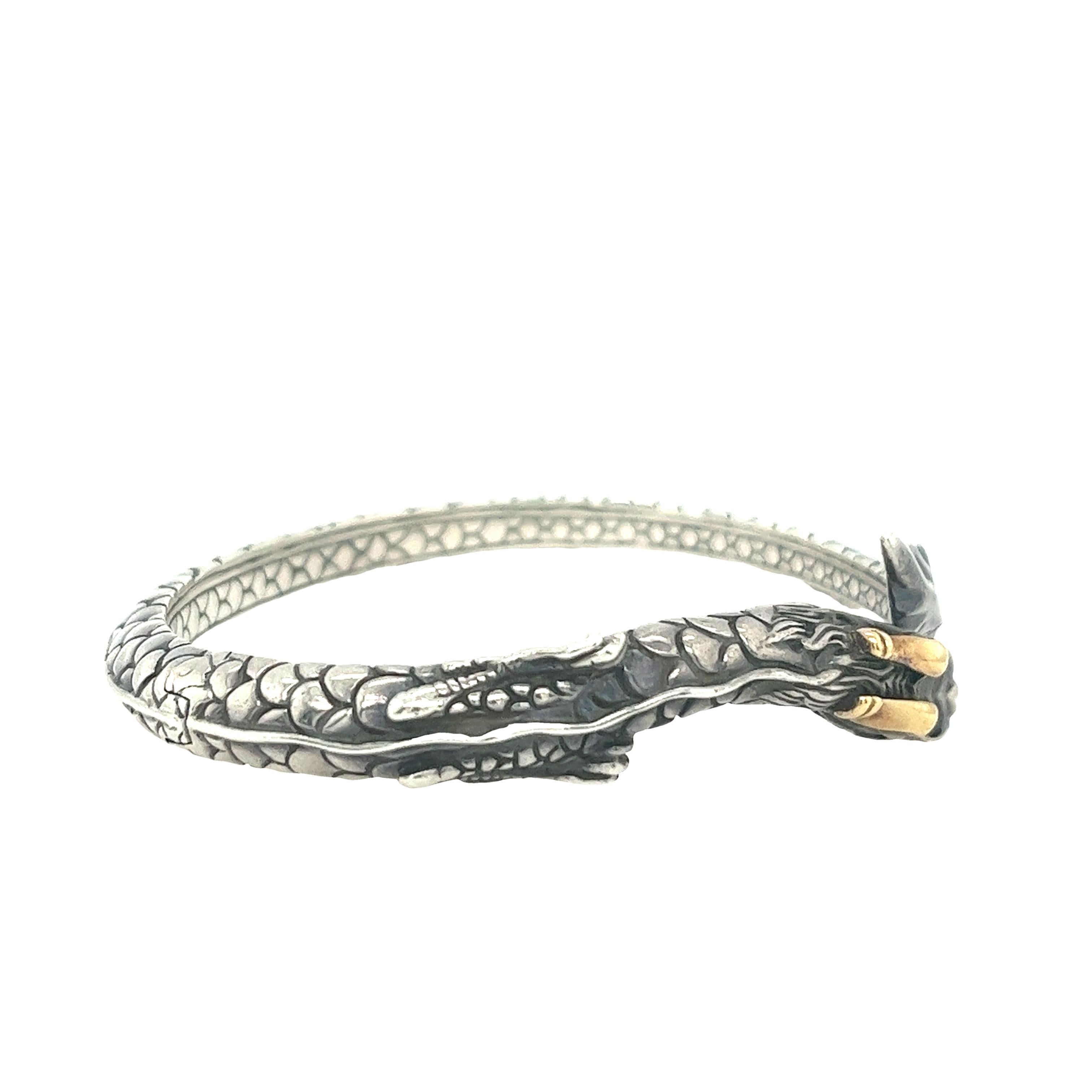 Stunning dragon kick-hinged naga dragon, is a captivating piece of jewellery 
With 925 sterling silver material and 18ct yellow gold.

Total Weight: 25.8g
Internal Diameter: 60.55mm x 45.50mm
Head Size: 15mm
Width of Bangle: 5.77mm
Papers &